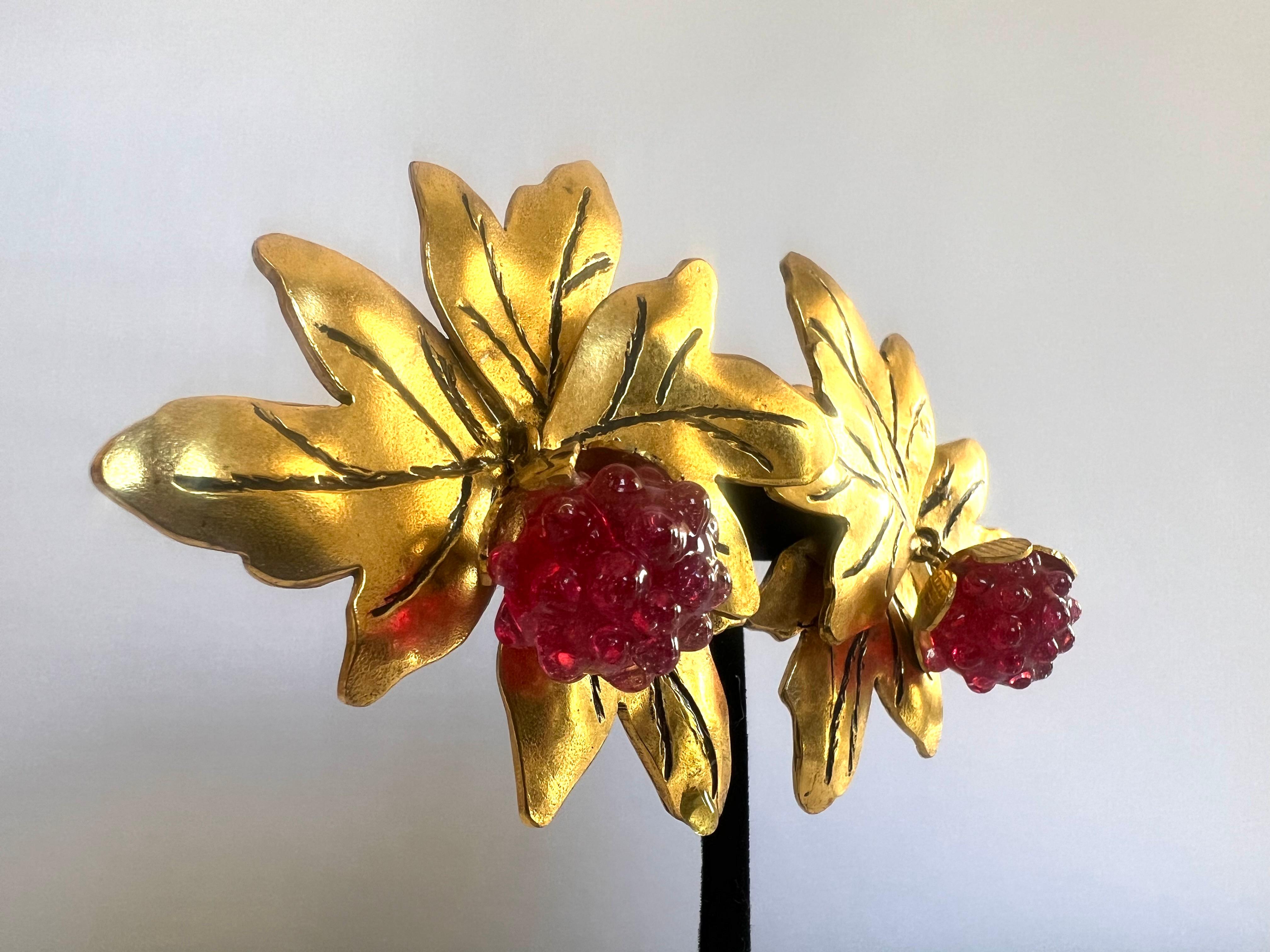 Scarce ornate vintage clip-on statement earrings by Isabel Canovas - featuring oversized gold and black leaves with red glass berry adornments.  
