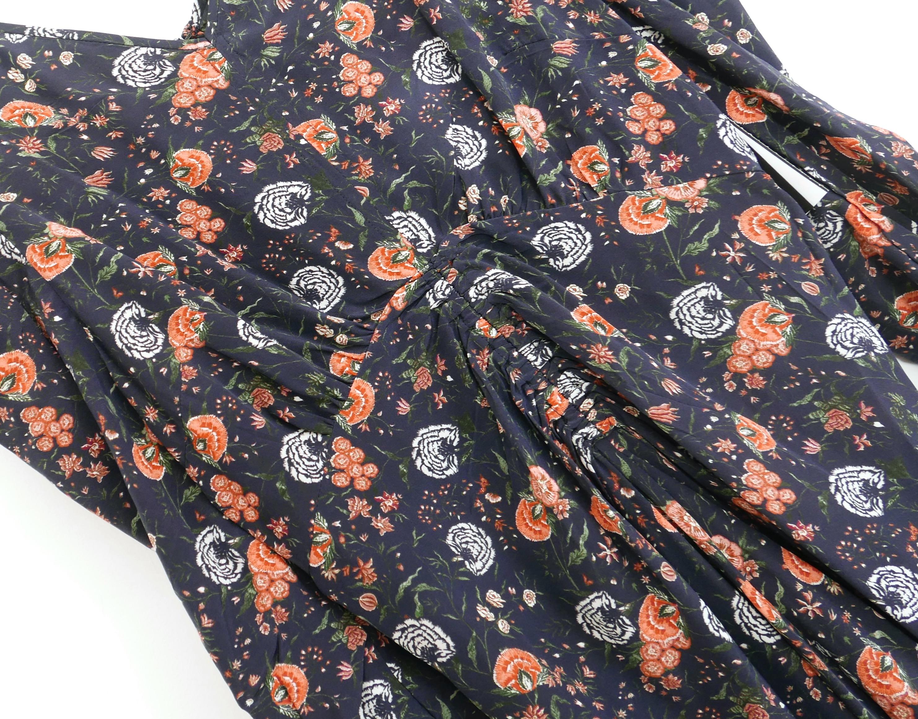 Signature Isabel Marant Albini dress - bought for €940 and new with tag. Made from Midnight navy floral carnation print jacquard silk, it has a super flattering cut with soft fit over the bust, ruched front, v neck and cropped ruched sleeves with