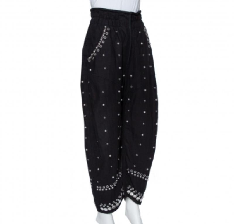 Isabel Marant's Eloma pants made using cotton feature a smocked waist, zip closure, four pockets, and embellishment of studs all over. Style guide: Team it with a fitted top, a belt, and open-toe heels.