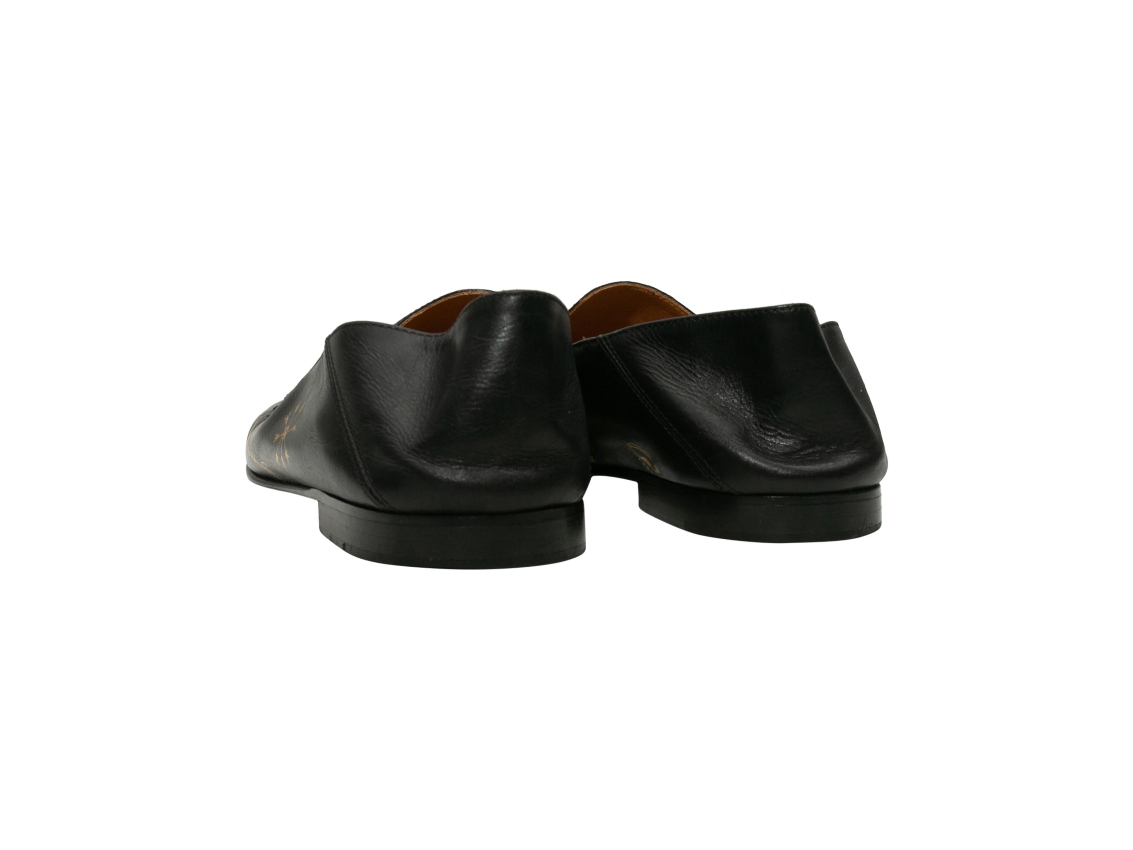 black and gold loafers