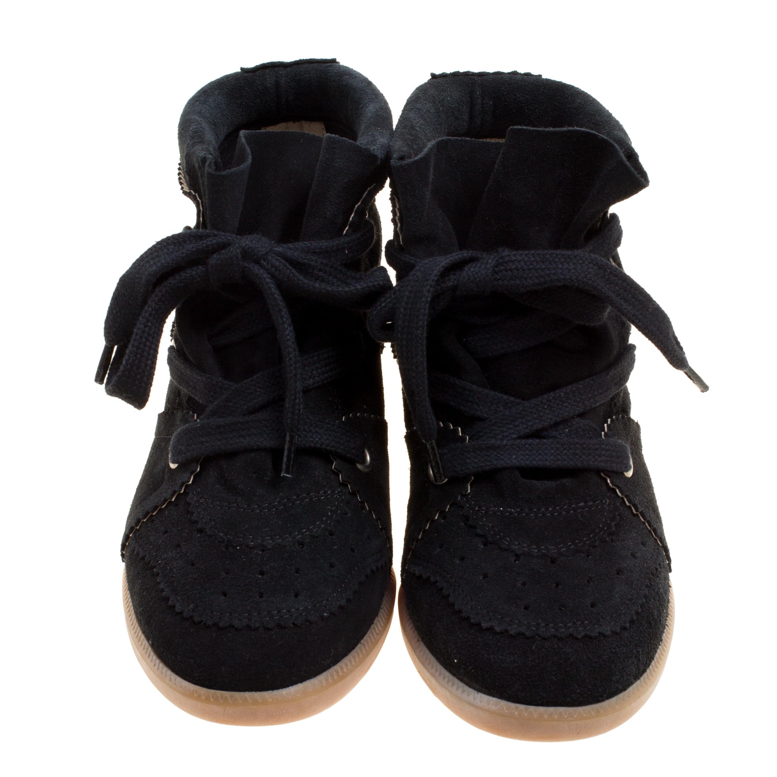 Whether you are travelling or simply out and about in the city, these Isabel Marant sneakers are a perfect choice. It is designed in a black suede body and detailed with lace-ups. They come with built-in wedge heels and make a comfortable wear for