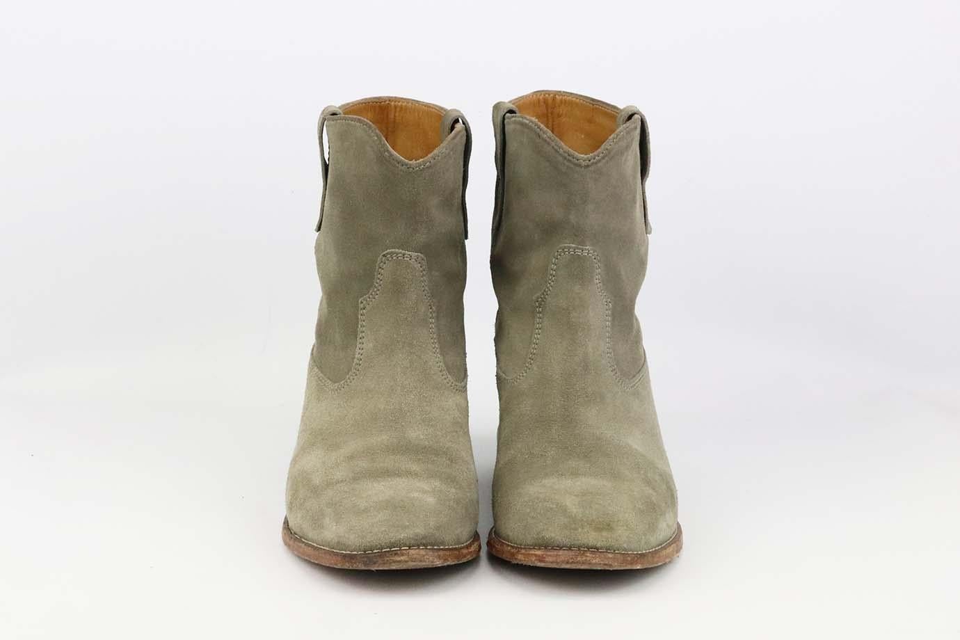 These 'Crisi' boots by Isabel Marant have a concealed interior 70mm wedge heel that provides a little extra height, made from plush faded-beige suede, they have almond-shaped toes and are detailed with Western-inspired topstitching. Sole measures