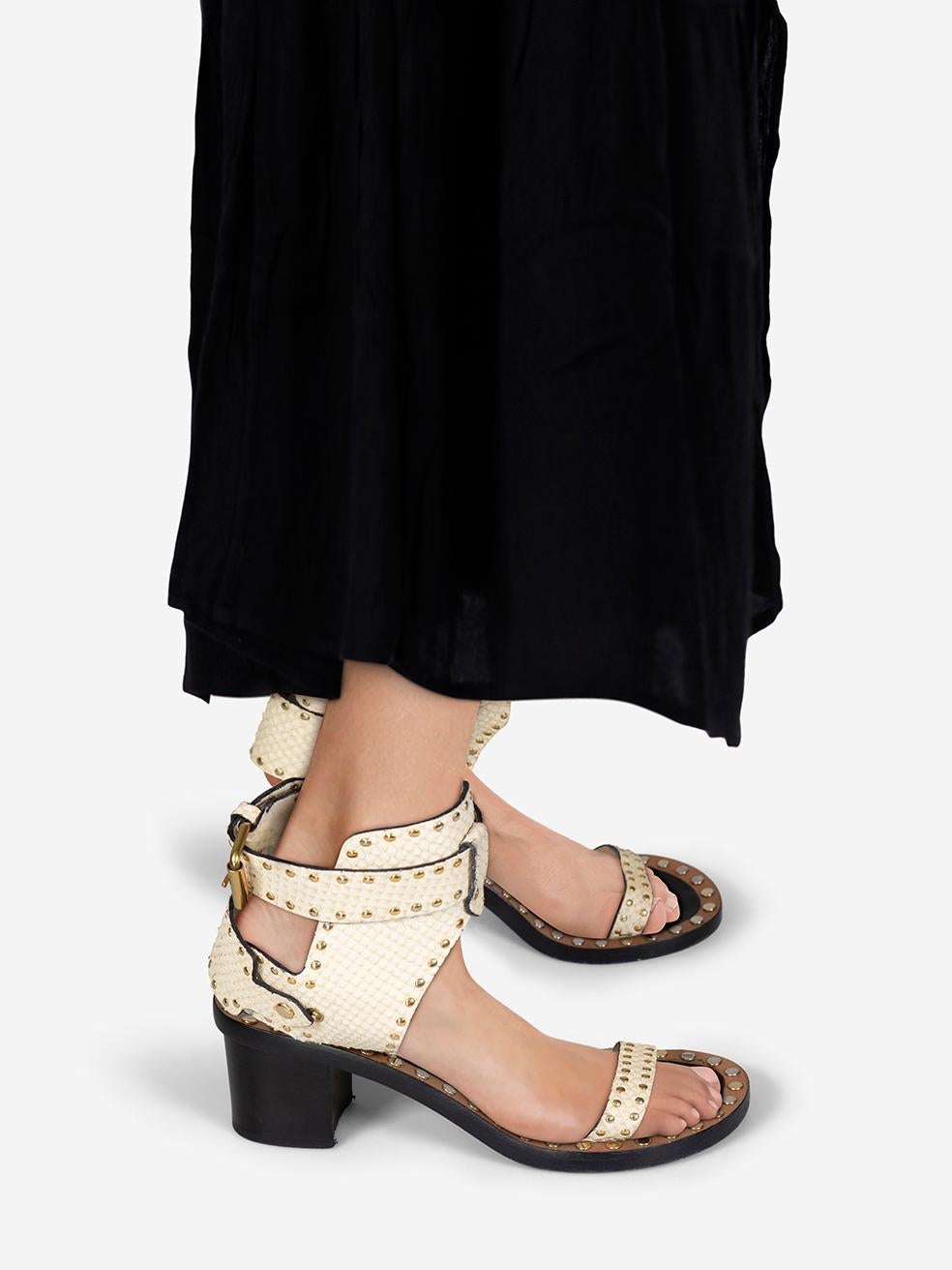 CONDITION is Very good. Minimal wear to the sandals is evident. Tarnishing to the studs across both shoes. Marks on both in soles and both ankle straps on this used Isabel Marant designer resale item.
 
 
 
 Details
 
 
 Model: Jaeryn
 
 Ecru
 
