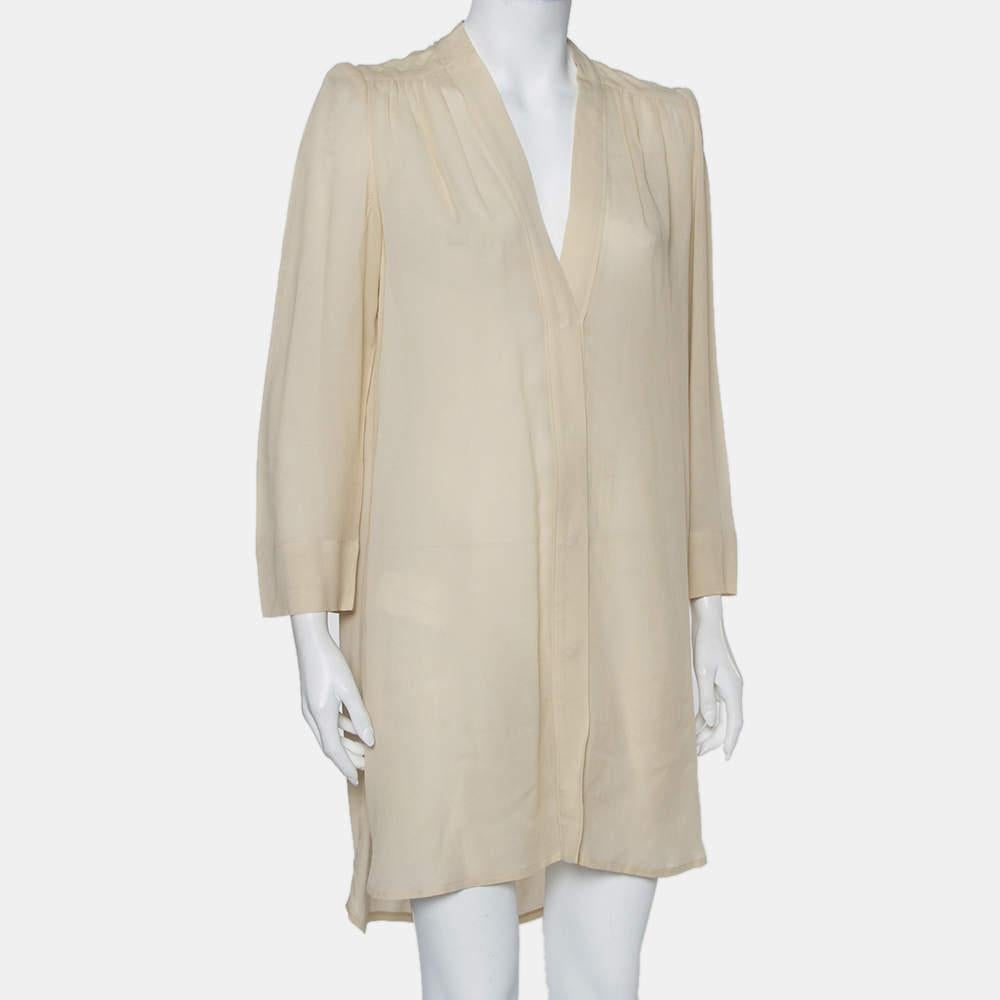 A casual, stylish shift dress from Isabel Marant that you can pair with both heels and flats. It is made from a cotton blend and features long sleeves, button closure, and a V neckline.


