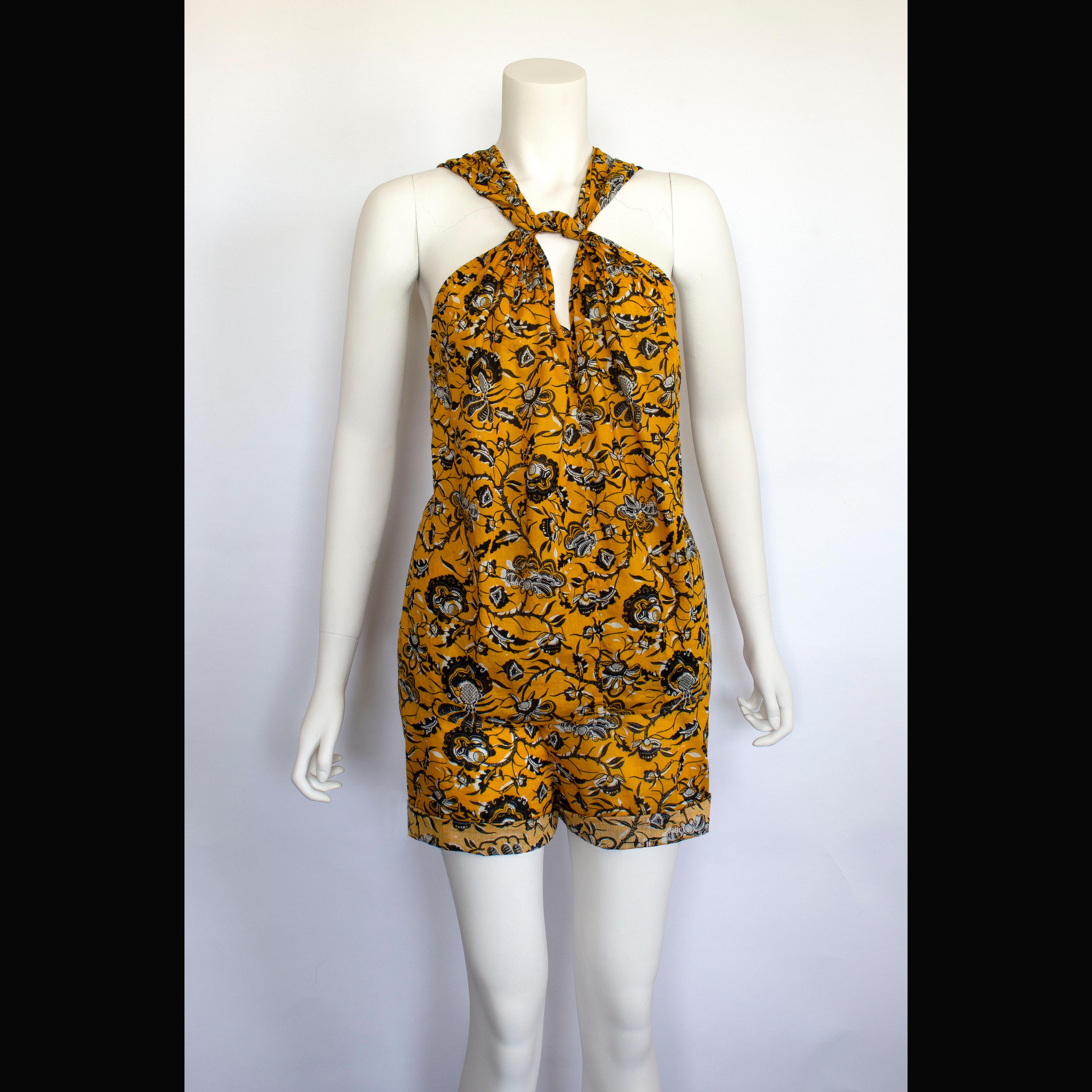 Product Details: Isabel Marant Etoile - Halter Top - Yellow, Black + White Floral Print
Label: Isabel Marant Etoile
Fabric Content: Printed Cotton - Yellow, Black + White Floral Print 
Size: Halter Top: FR 38
Halter Top: FR 38 
Bust Circ (Underarm