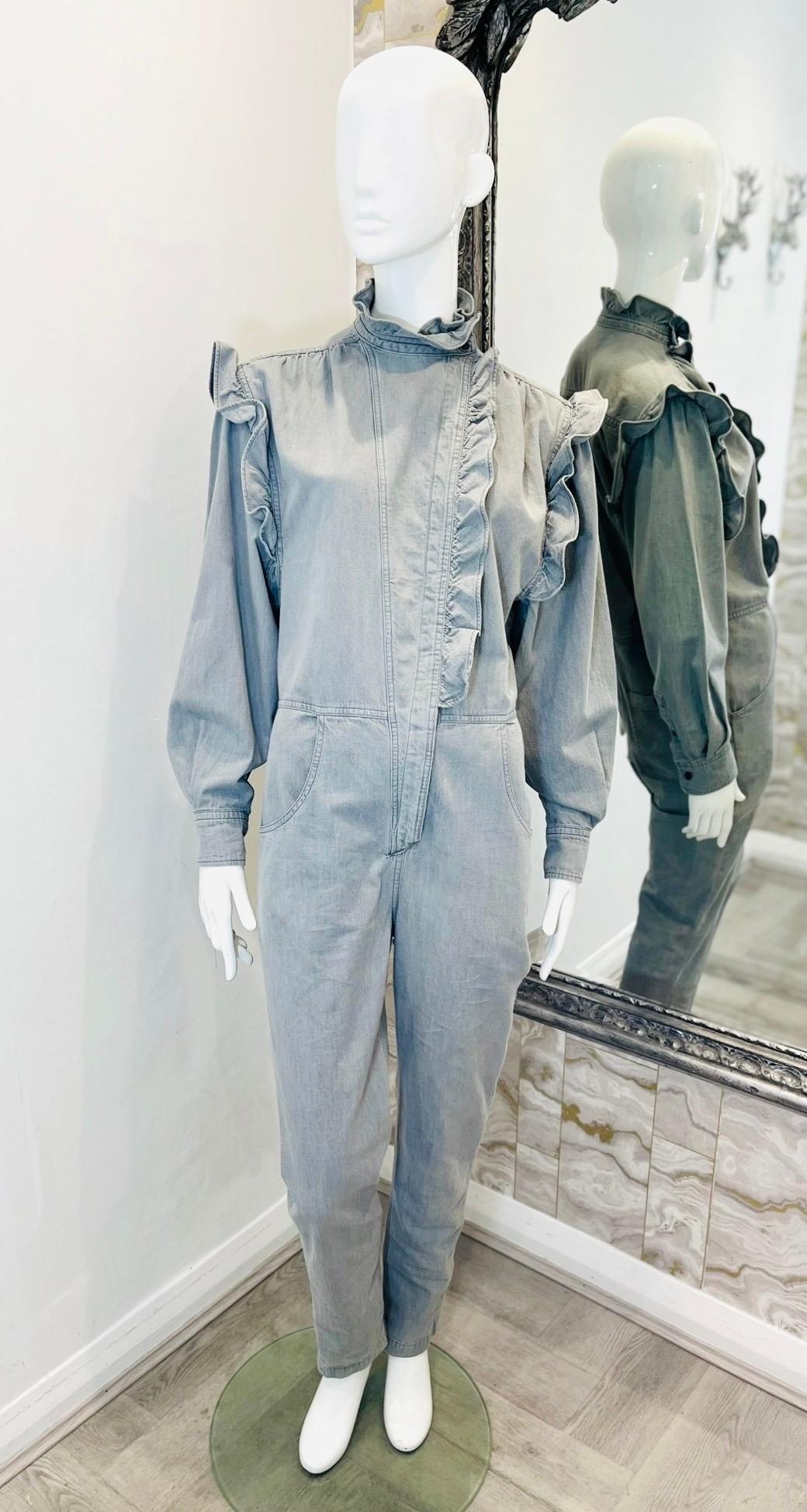 Isabel Marant Etoile Ruffled Cotton Jumpsuit

Grey 'Gayle' jumpsuit designed with ruffle detailing to the high-neck, shoulders and asymmetric front placket.

Styled with balloon sleeves and utility-inspired front and back pockets.

Featuring relaxed