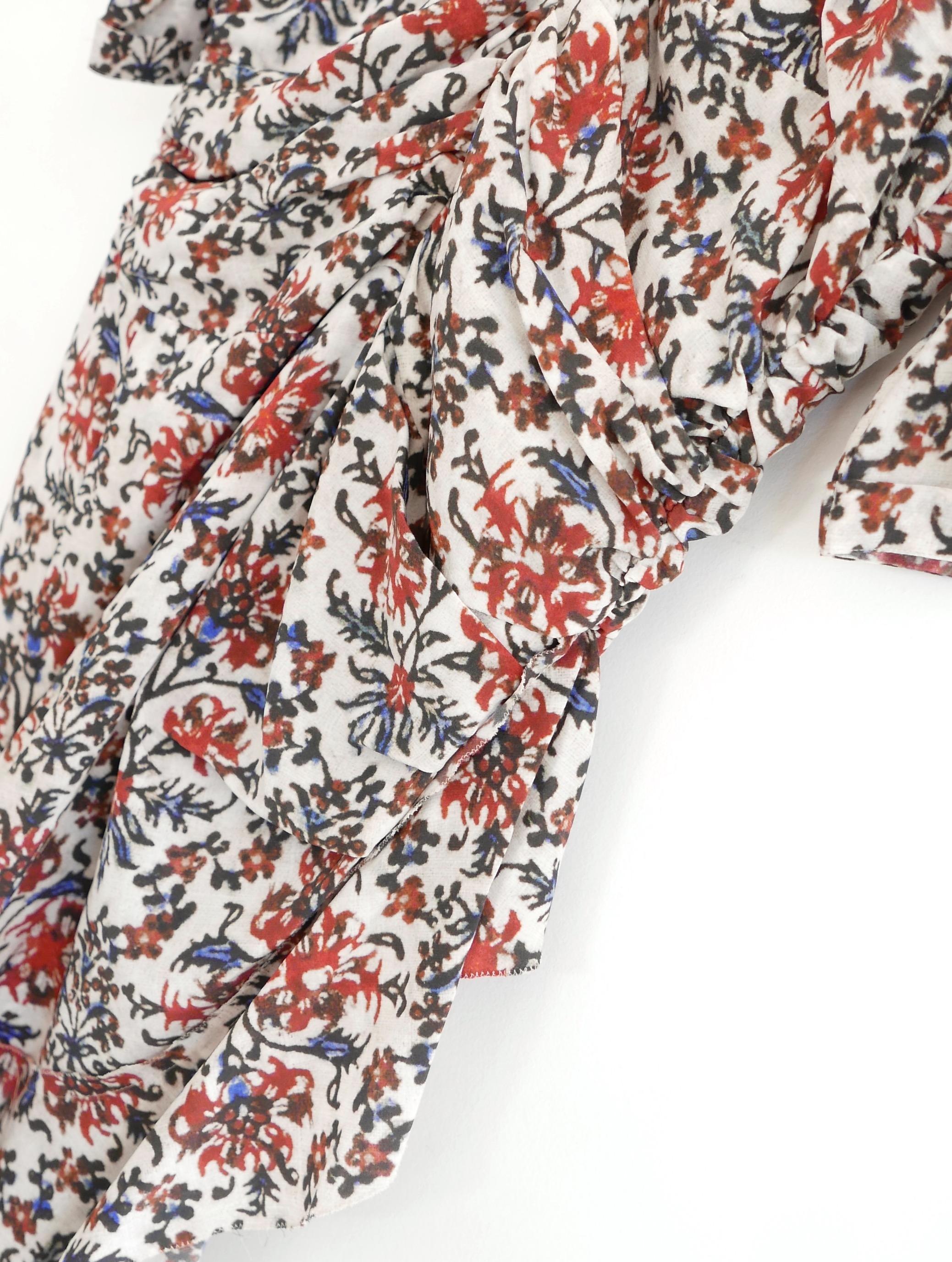 Stunning Isabel Marant Arodie floral print dress. Worn twice and has been newly dry cleaned. Made from gorgeous red and blue floral silk crepe and is half lined. It has a ruched bust, frilled hem wrap skirt and feature back zip. Size FR42/UK14.