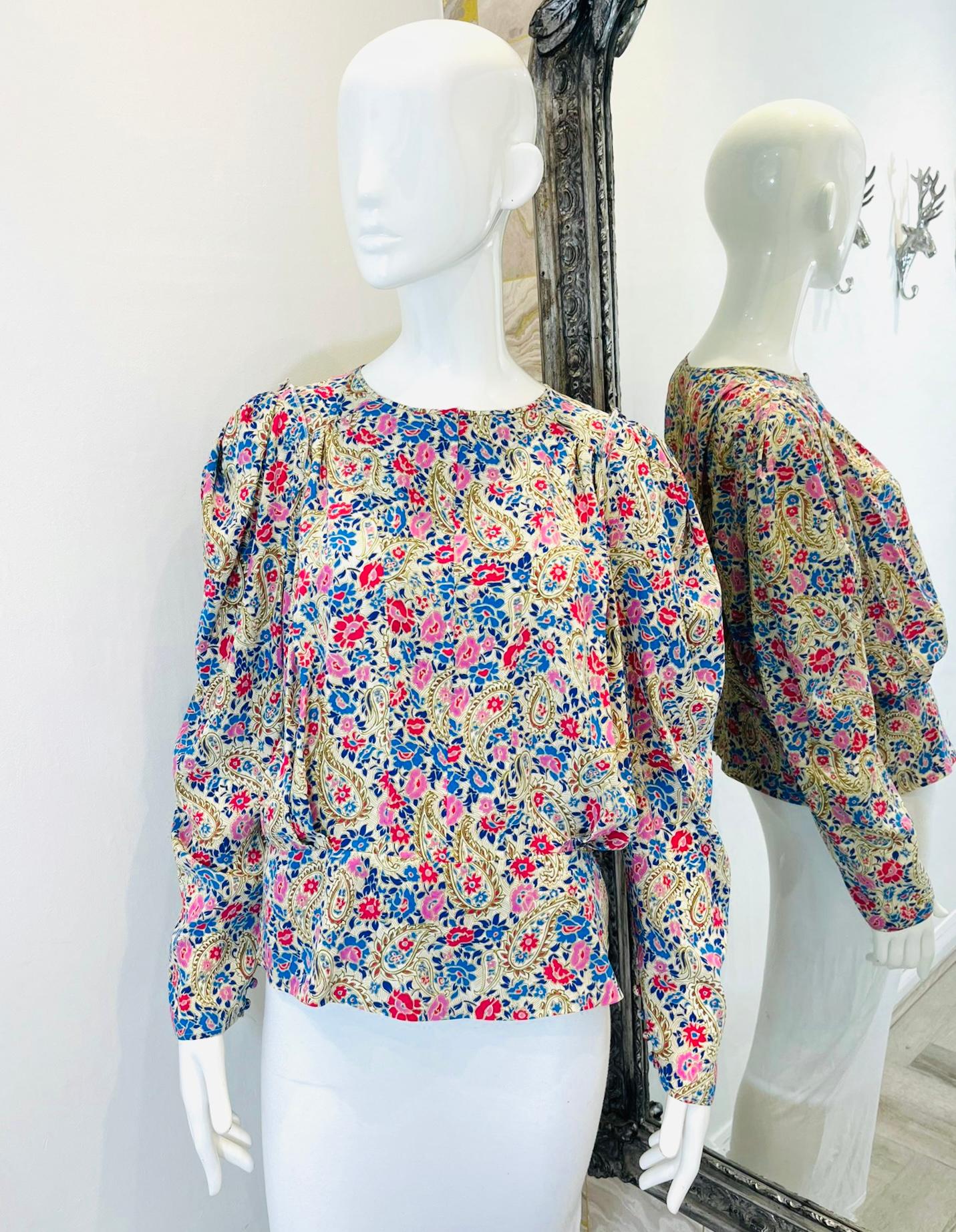 Isabel Marant Floral Silk Top

Multicoloured, floral patterned blouse designed with long puffed sleeves and pleat detail to the front.

Featuring round neckline and concealed zip fastening to rear. Rrp £700

Size – 44FR

Condition – Very