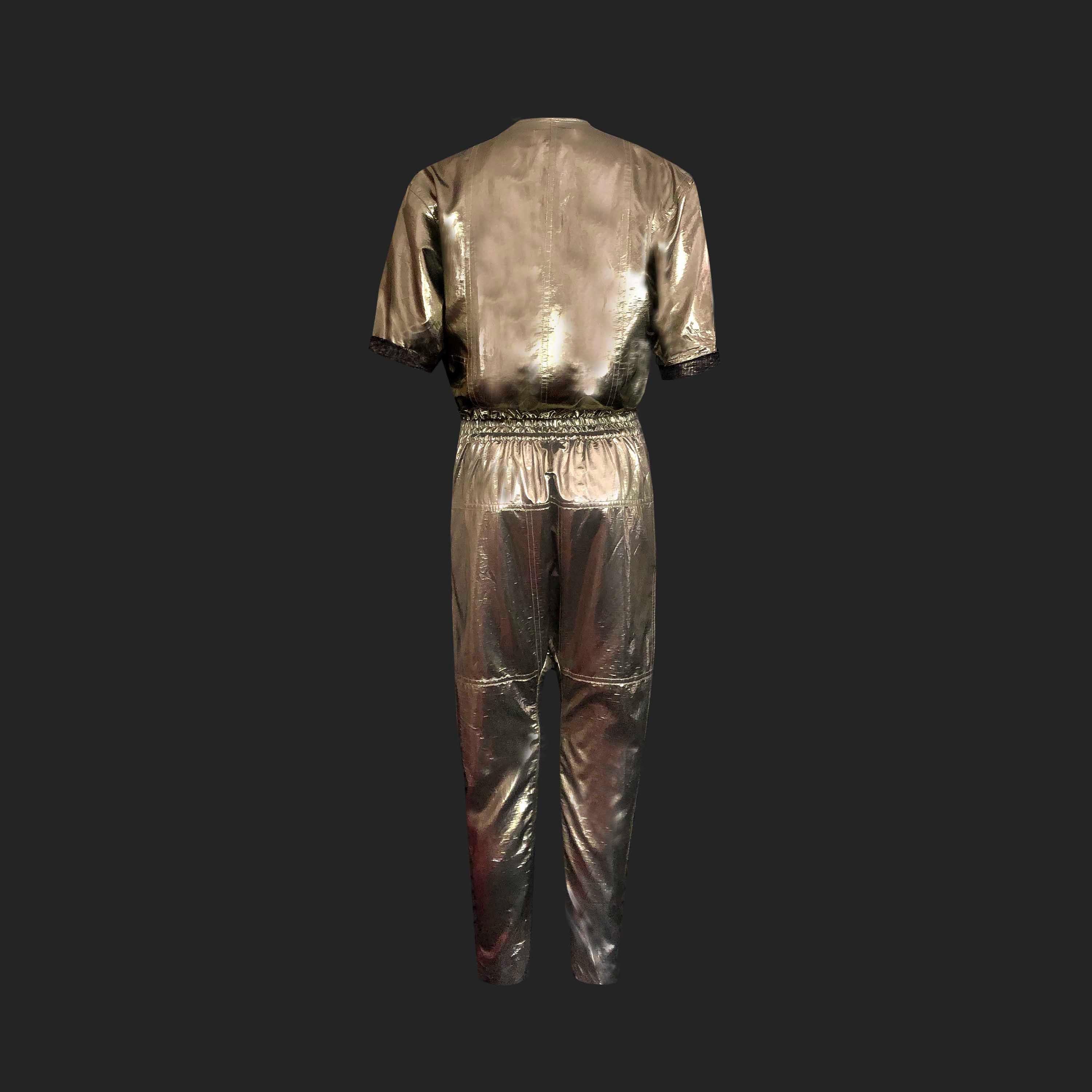 Product Details: Isabel Marant - Gold Lame Jumpsuit - Two Way Collar - Elastic Waist + Double Tie - Two Way Collar - Roll Up Sleeves - x 2 Side pockets - Harem Dropped Crutch Detail 
Label: Isabel Marant
Size: FR 34 (Fits UK 8 to UK 10)
Fabric