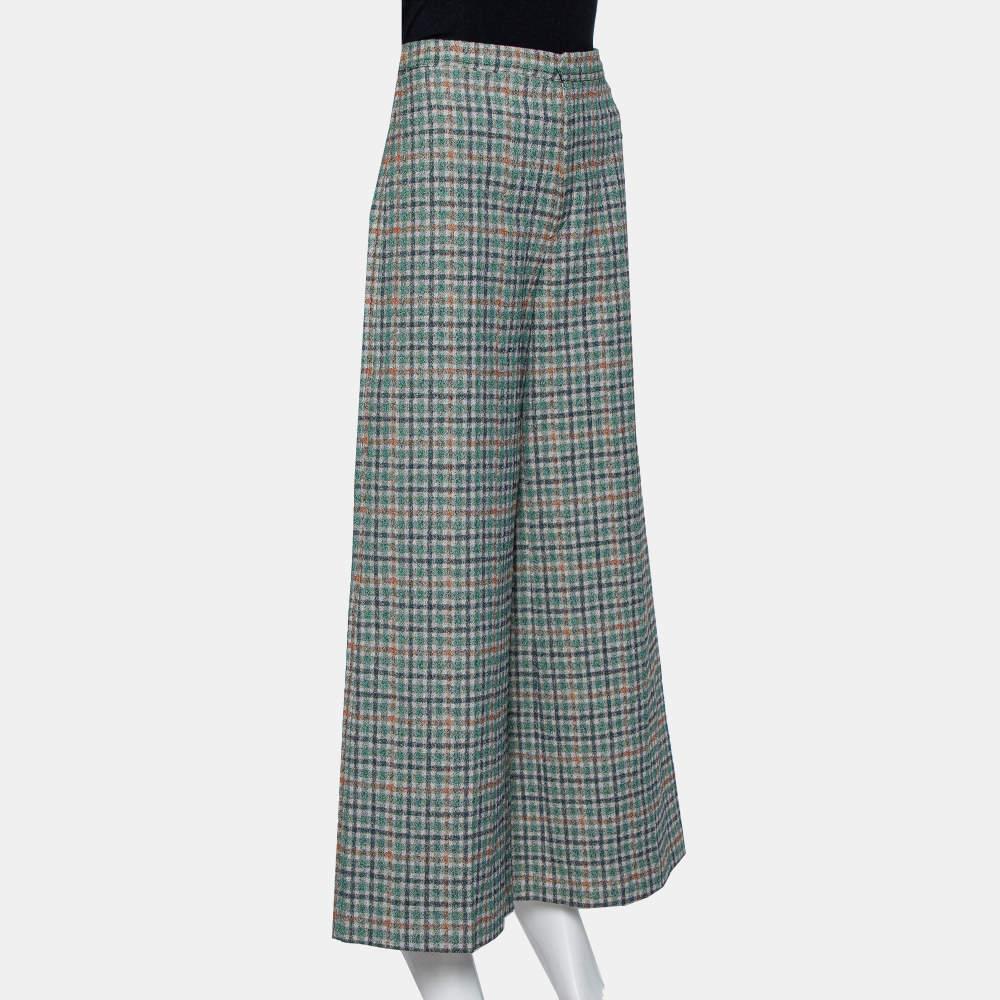 Presenting fine tailoring signs, a wide-leg silhouette, and a grand appeal, these green Prince Of Wales check cotton trousers by Isabel Marant are highly comfortable and offer a great wearing experience. The pair features a zip closure, a high