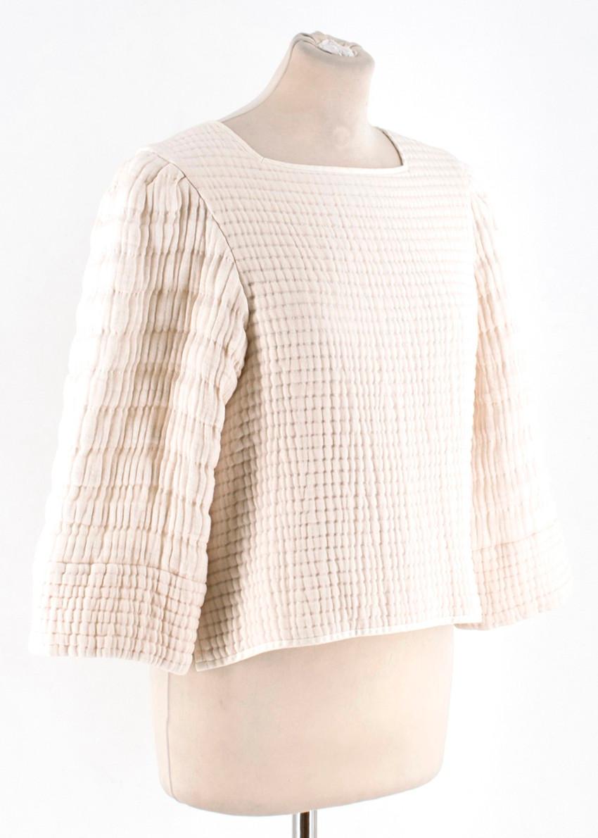 Isabel Marant Greg quilted-cotton cream top

- Cream, quilted cotton
- Square neck, 3/4 length sleeves, padded shoulders 
- Flat hem, side splits 
- Centre-back concealed half-zip fastening 
-100% cotton. 

Please note, these items are pre-owned and