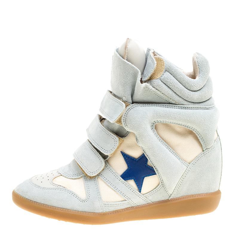 Stylish and comfortable, these sneakers by Isabel Marant have been created to be flaunted. They feature suede exteriors enhanced with canvas and styled with velcro straps and star details. The pair also comes with padded tongues and concealed