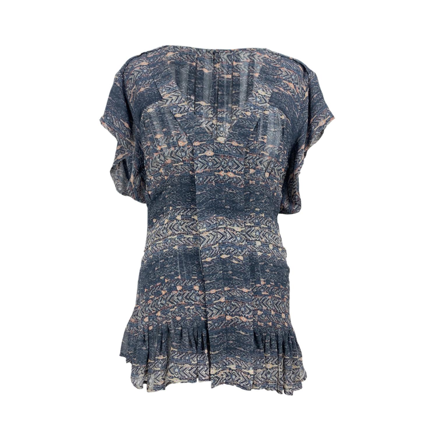 Beautiful Isabel Marant grey silk short sleeve top. Composition: 100% Silk. Rear zip closure. V-neck. Pleated detailing on the hem and on the back. Size:36 FR (The size shown for this item is the size indicated by the designer on the label). It