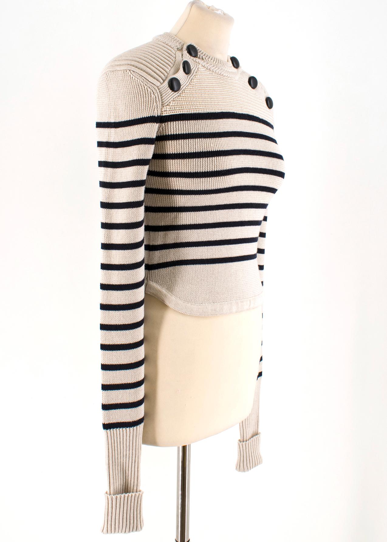 Isabel Marant Hatfield Striped Merino Wool Knit Sweater

- Extra-Fine Merino Wool Knit Sweater 
- Classic Stone and Navy Blue Breton Stripes 
- Round neck, Black Buttons aligned at collar bones 
- Ribbed collar and hems 
- Slim Silhouette 
- 65%