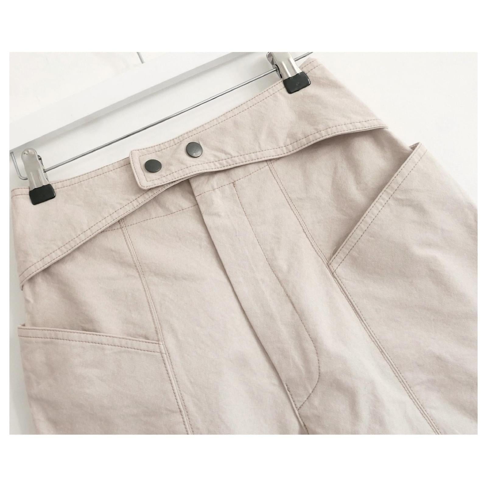 Super cool Isabel Marant jodhpur style trousers. Worn once and come with spare button. Made from soft beige cotton, they have a high waisteded with cross over cummerbund detail, large pockets and tapered legs. Size FR34/UK6. Measures approx - waist