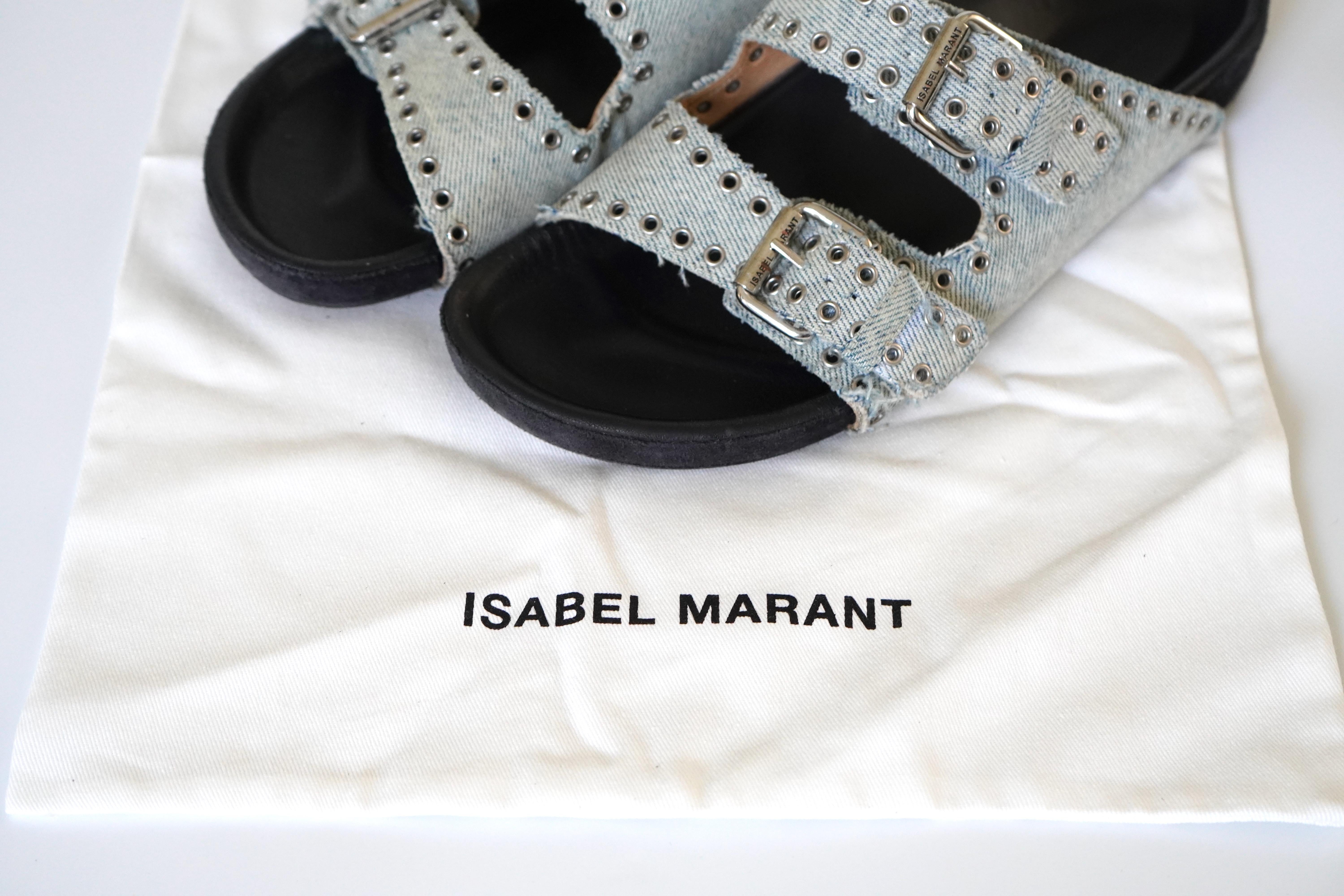 Isabel Marant Lennyo Denim Dual-buckle Eyelet-embellished Sandals. They are made of leather and cotton. We have them in size EU 39. Comes with the duster bag. Some minor wear, still in great condition. 

Isabel Marant is an eponymous clothing brand