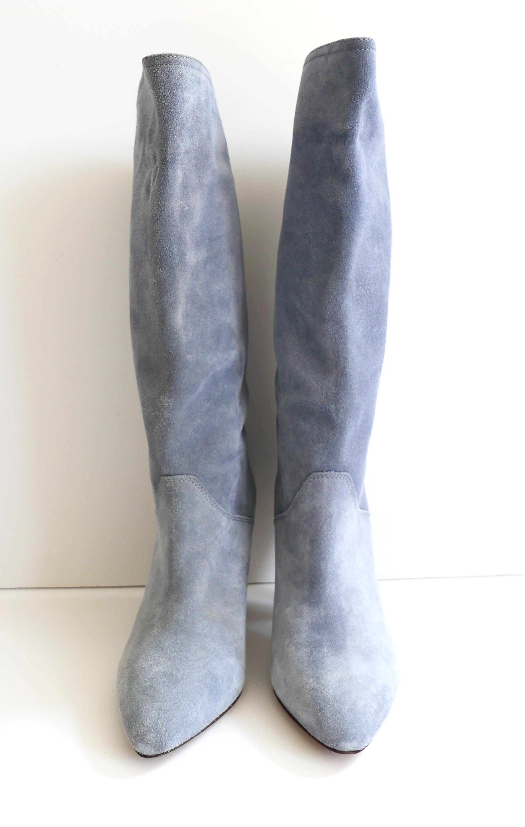 Super chic Isabel Marant Lestee cowboy boots. Made from Greyish Blue suede with stacked cone heels and vented, curved tops. Size 36. Measures approx - 10” heel to toe and heel is 3.5”. Show light wear to heel ends. Worn once indoors and come with