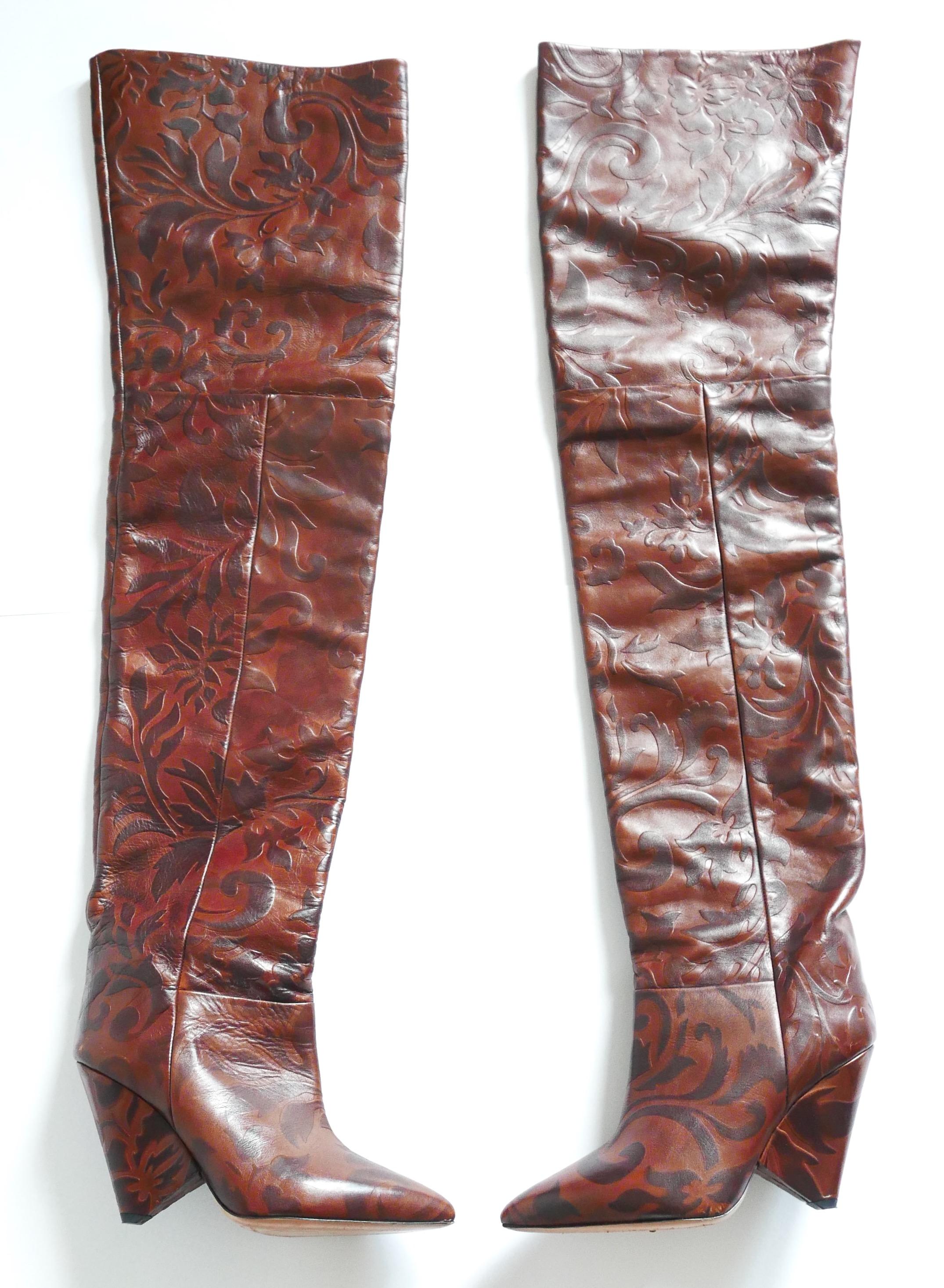Iconic Isabel Marant Lostynn embossed-leather thigh high boots from the Fall 2017 catwalk and Ad Campaign. Bought for £1250 and worn twice - come with dustbag. Made from chestnut brown tooled leather, they have pointed toes, cone shaped heels and