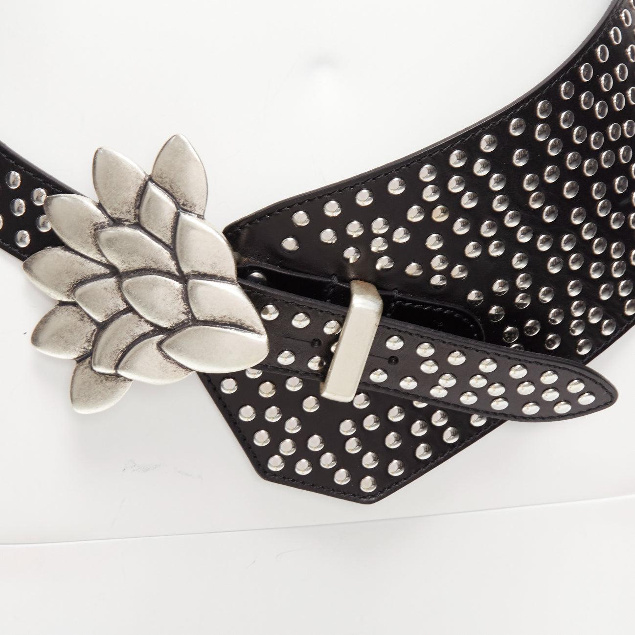 ISABEL MARANT Lowai silver petals buckle studded black leather wide belt S
Reference: AAWC/A01205
Brand: Isabel Marant
Model: Lowai
Material: Leather, Metal
Color: Black, Silver
Pattern: Studded
Closure: Hook & Bar
Lining: Black Leather
Made in: