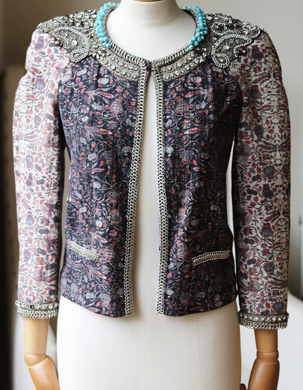 Steeped in Parisian charm but with a signature quirky twist, Isabel Marant's expertly embellished cotton jacket is the ultimate trophy coverup.
Show off this sensational crystal and bead-trimmed piece over your favourite dress, or a pair of jeans