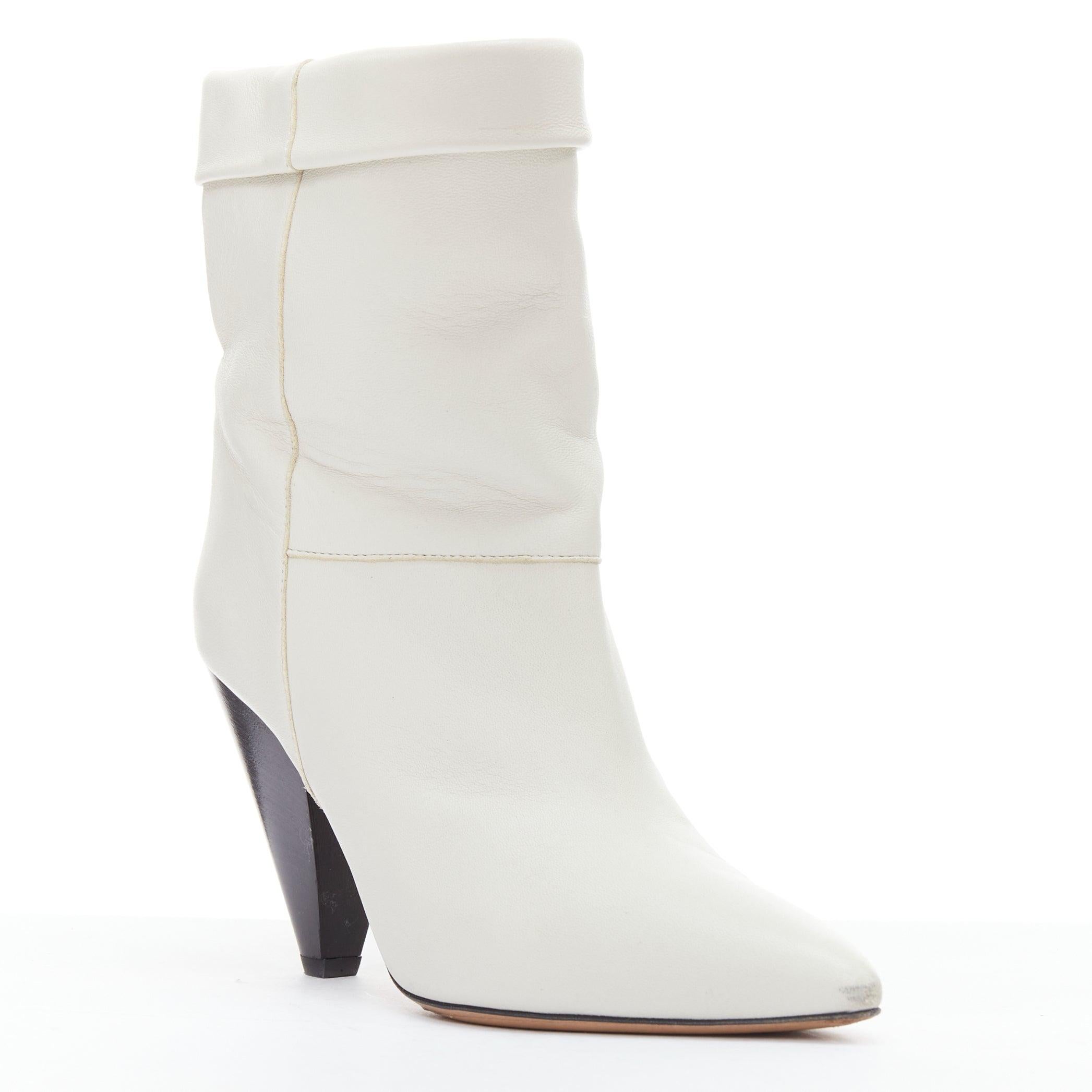 ISABEL MARANT Rouxa off white leather black cone heel boots EU36
Reference: LAYU/A00056
Brand: Isabel Marant
Model: Rouxa
Material: Leather
Color: Cream, Black
Pattern: Solid
Closure: Slip On
Lining: Nude Leather
Extra Details: Cone heels.
Made in: