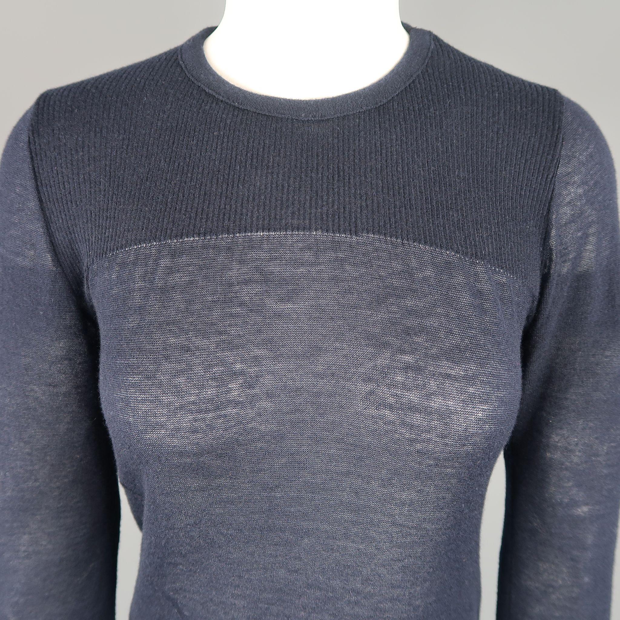 ISABEL MARANT pullover comes in navy ultra sheer burnout cashmere with a round neck, ribbed chest, diagonal seam, and slit hem. Made in France.

Good Pre-Owned Condition.
Marked: L

Measurements:

l Shoulder: 13 in.
l Bust: 34 in.
l Sleeve: 25 in.
l