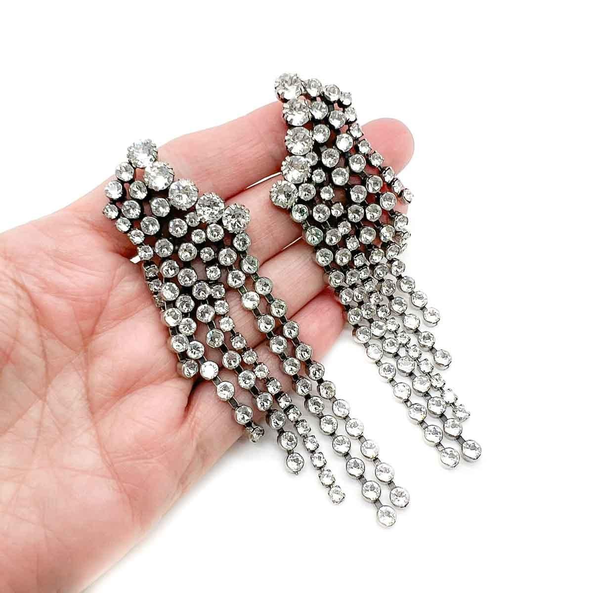 A truly decadent Pair of Isabel Marant Crystal Cascade Earrings. Cascades of crystals abound. Clever post positioning has the earring top climbing the lobe above the wonderfully long and dramatic drop. Need we say more ? Only question is what will