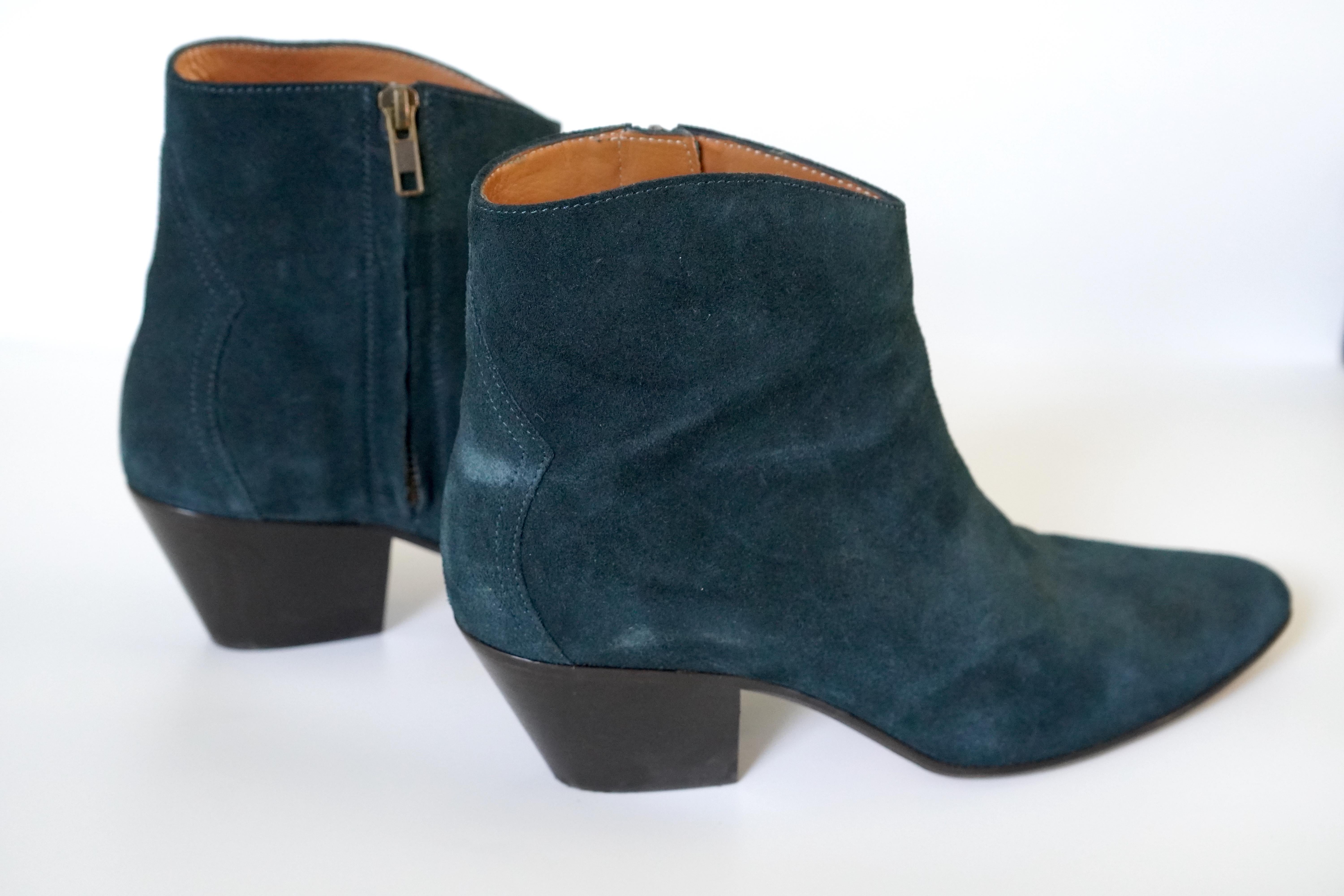 Isabel Marant Blue ankle boots. These boots are made of 100% leather in a beautiful dark blue color. The heel height is 2 inches and feature a side zip on the inside ankle of each boot. Previously worn, with minor signs of wear, still in great
