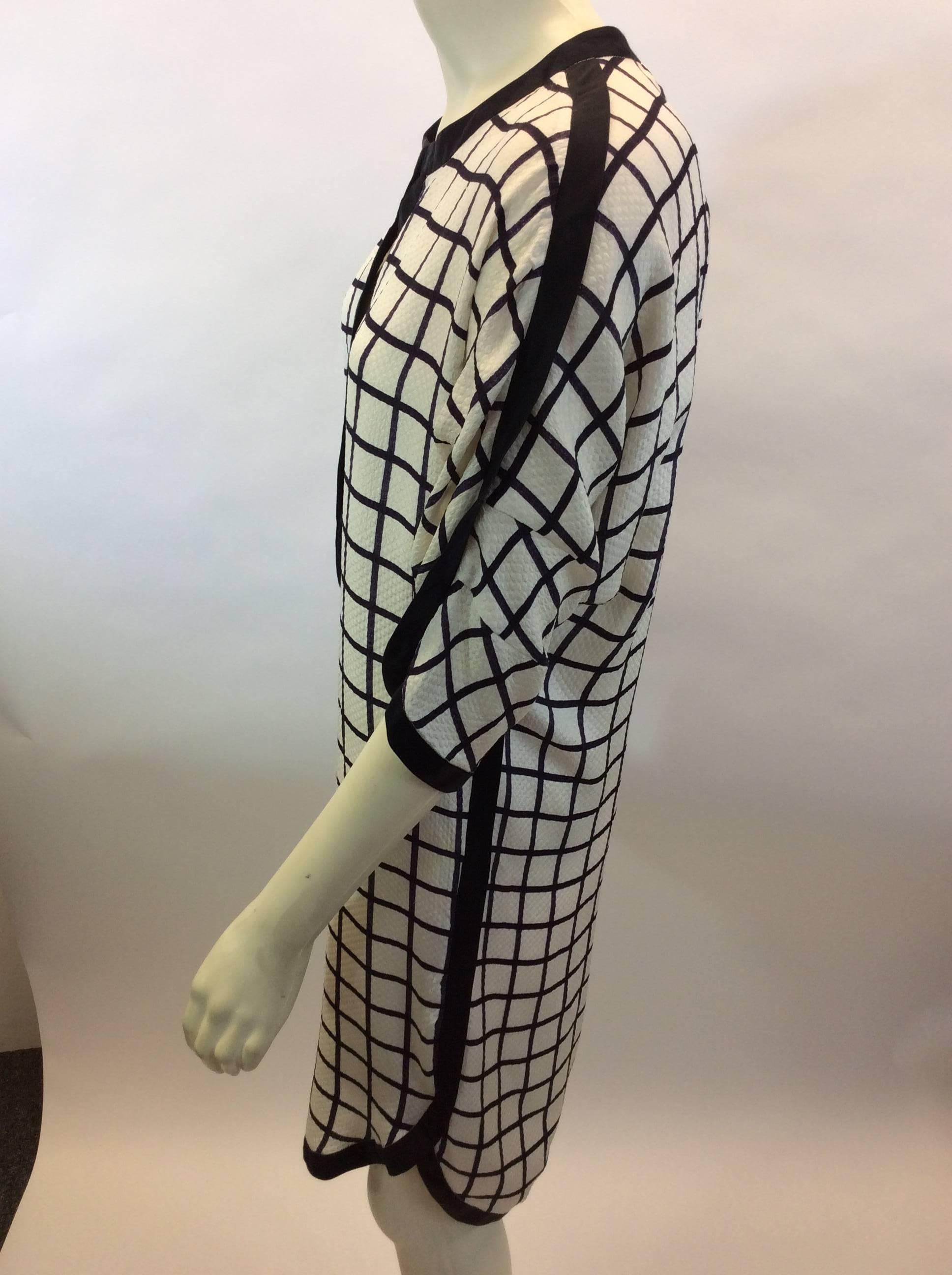 Isabel Marant White and Black Windowpane Dress
$199
Made in India
60% Cotton
40% Silk
Trim-100% Silk
Size 34
Length 35.5