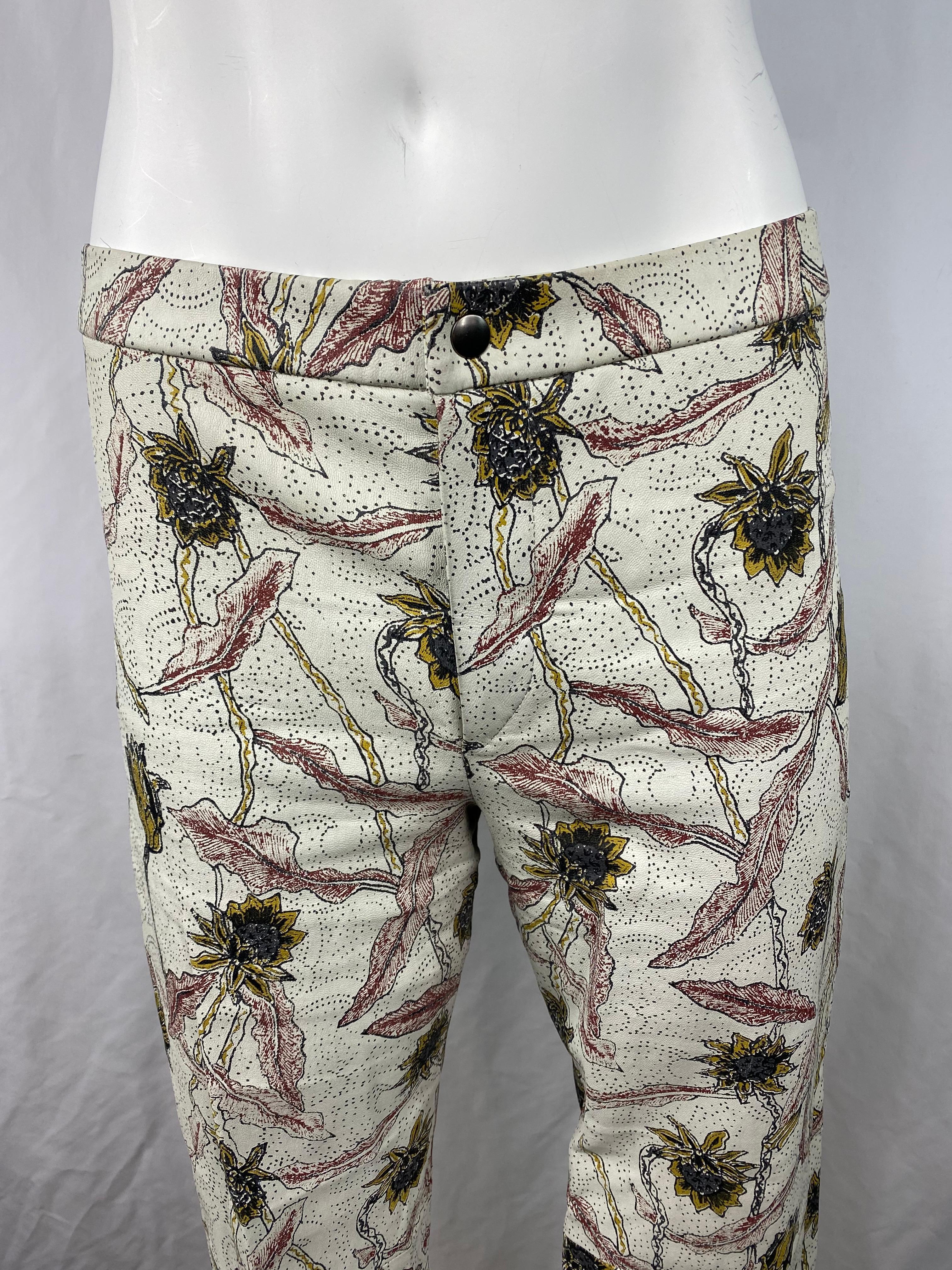 Product details:

The pants are made out of 100% lambskin leather, they feature floral print, straight leg fit with front button and zip closure and side slip detail (7 inches long). Made in France.