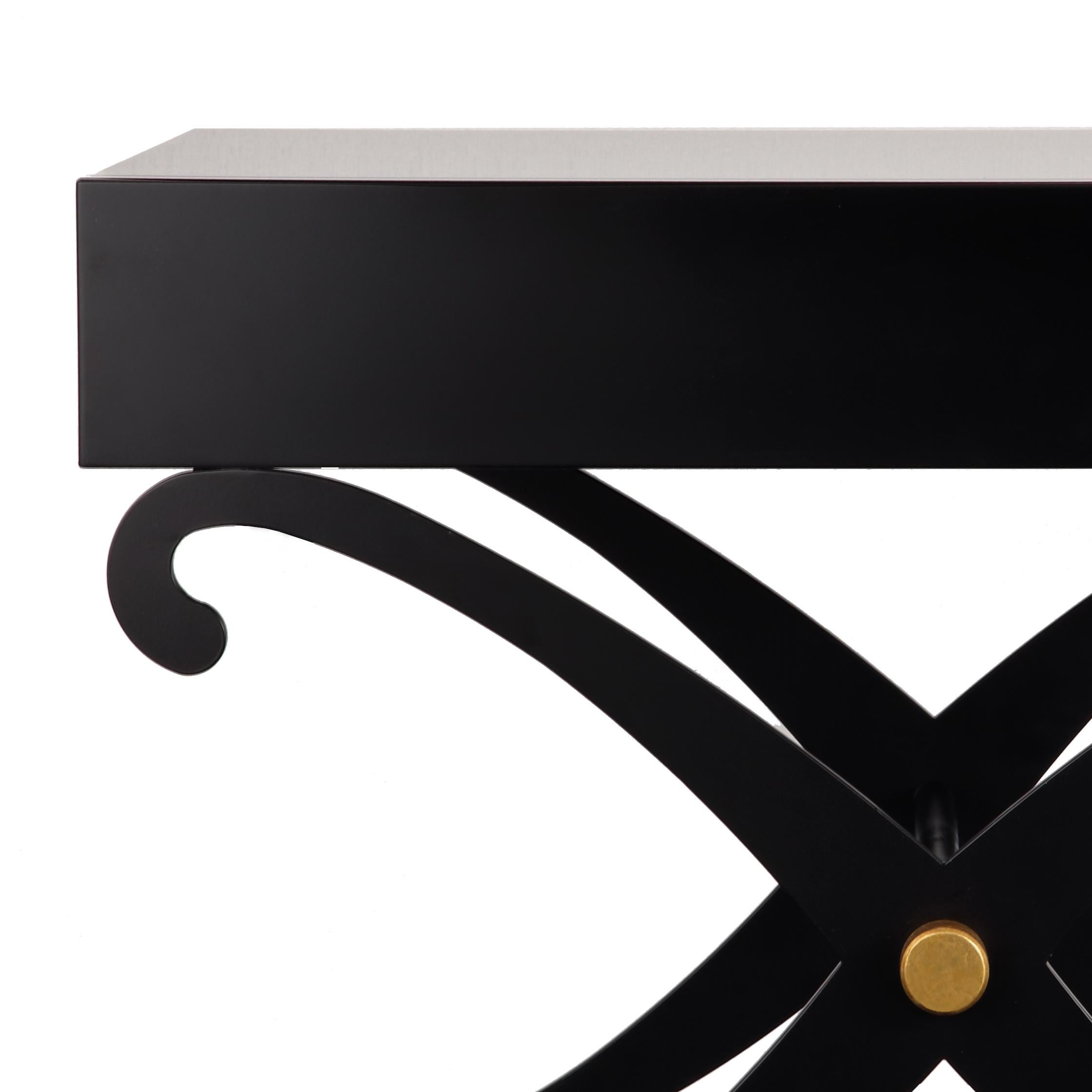 Designed by IC and realized by skilled Italian artisans, the top of the side table is crafted entirely in wood and lays on a curving cross-leg base with gold leaf detail. It is of exemplary quality and can be used either as nightstand or side
