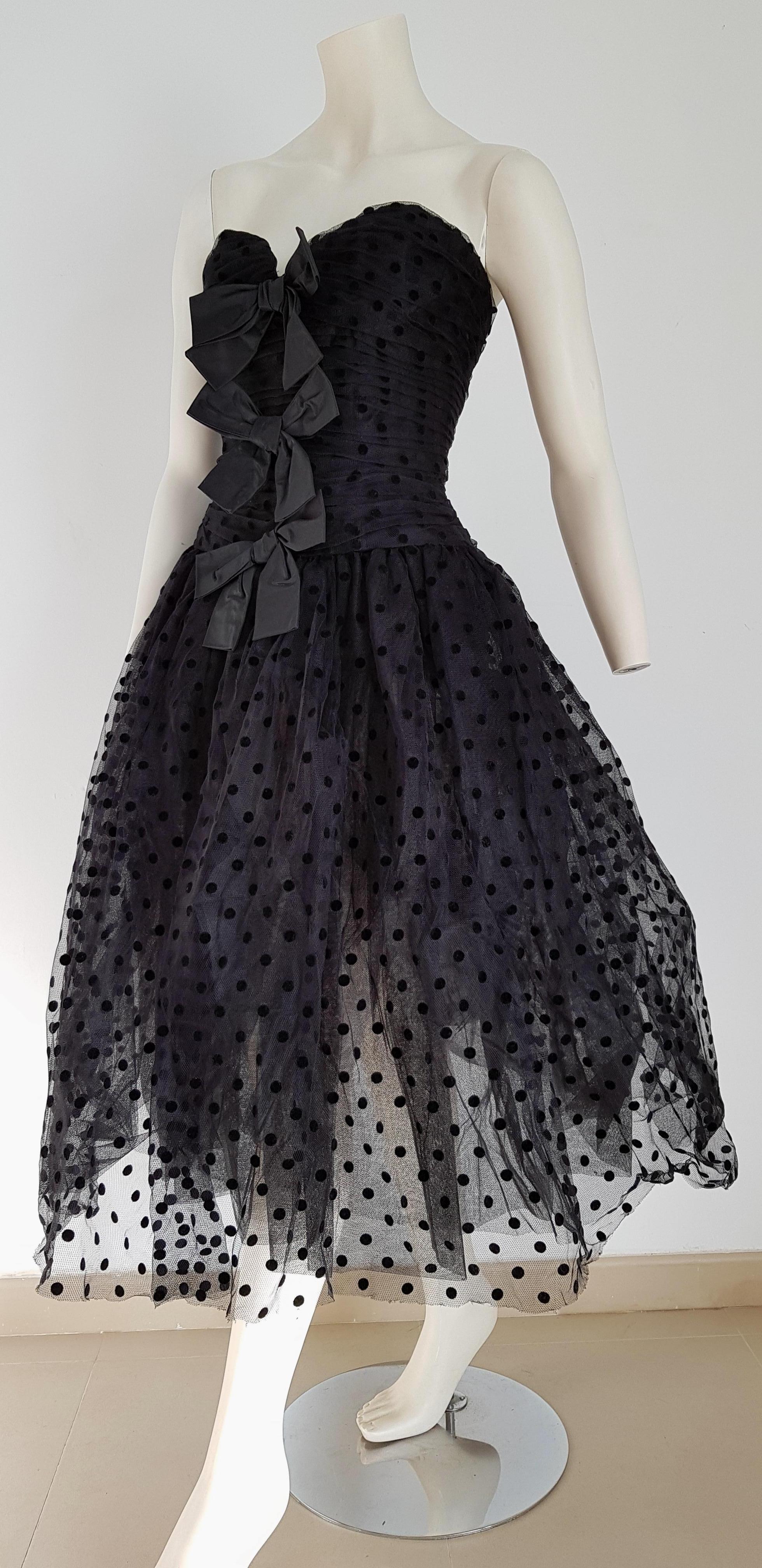 Isabelle ALLARD Paris, black velvet polka dots, plumetis black fabric, three knotted front ribbons, slightly transparent skirt, strapless dress - Unworn, New.

Isabelle ALLARD is a fashion designer that created only haute couture and selling to