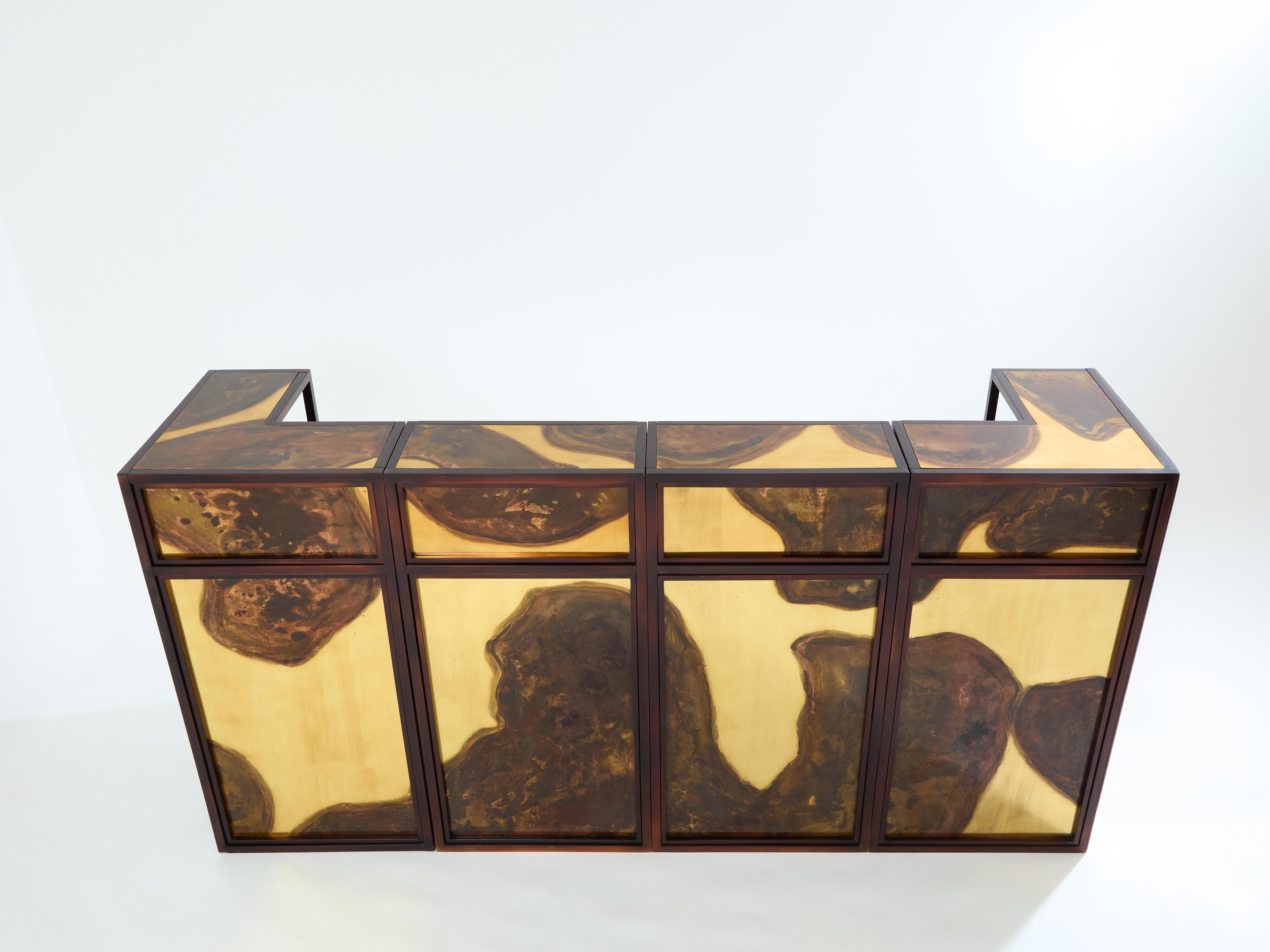 A unique bar for a standout look. This unique set of four cabinet counters were created by Isabelle and Richard Faure for Parisian design firm Maison Honore in the late 1970s. Each element is entirely covered by decorated oxidized and patinated