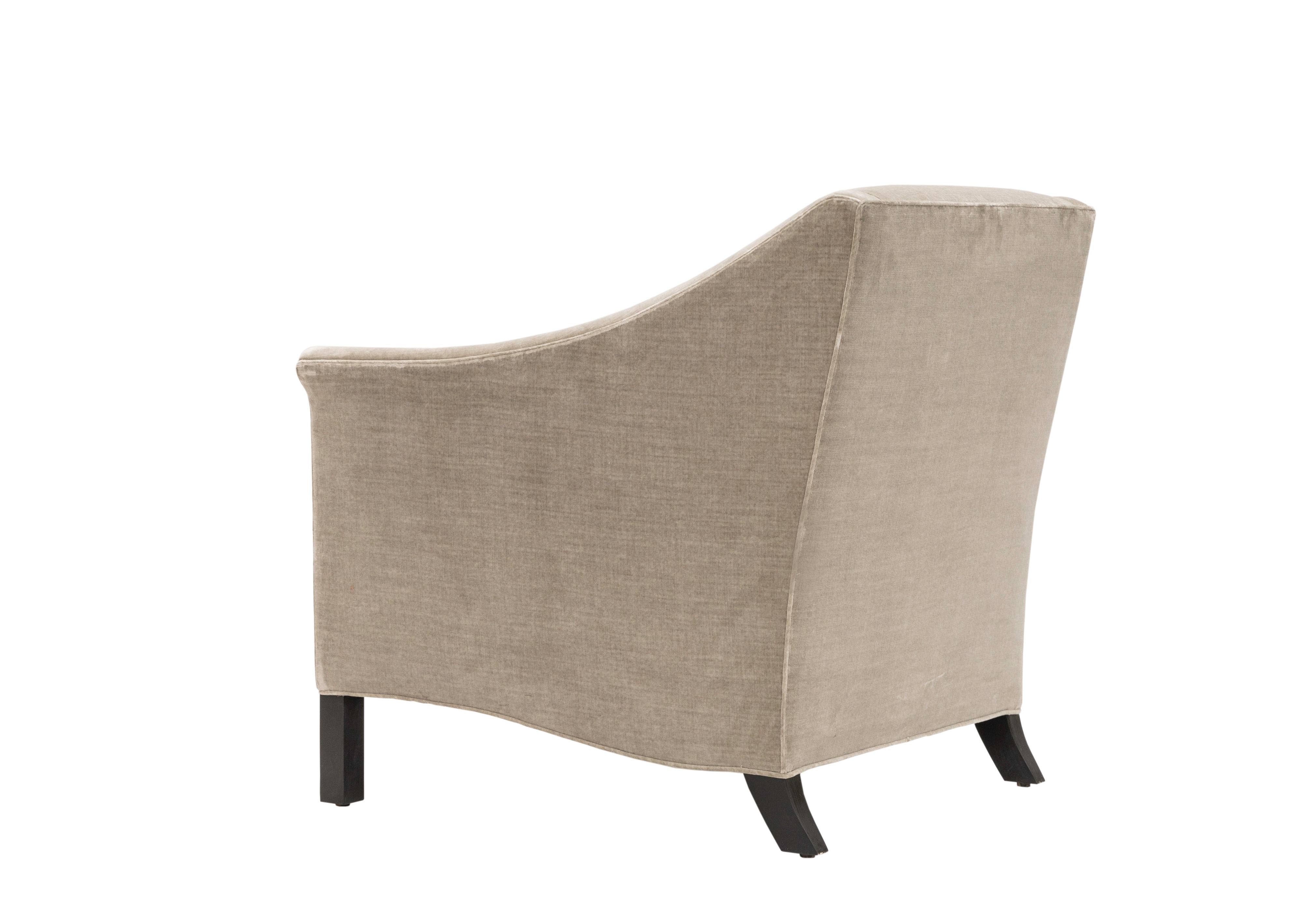 The Isabelle chair has a tight upholstered back and loose seat cushion. Squared front legs and curved back legs are made of blackened hardwood.

This Isabelle chair is a made to order item and hand crafted in the US. 
Customer's own material is