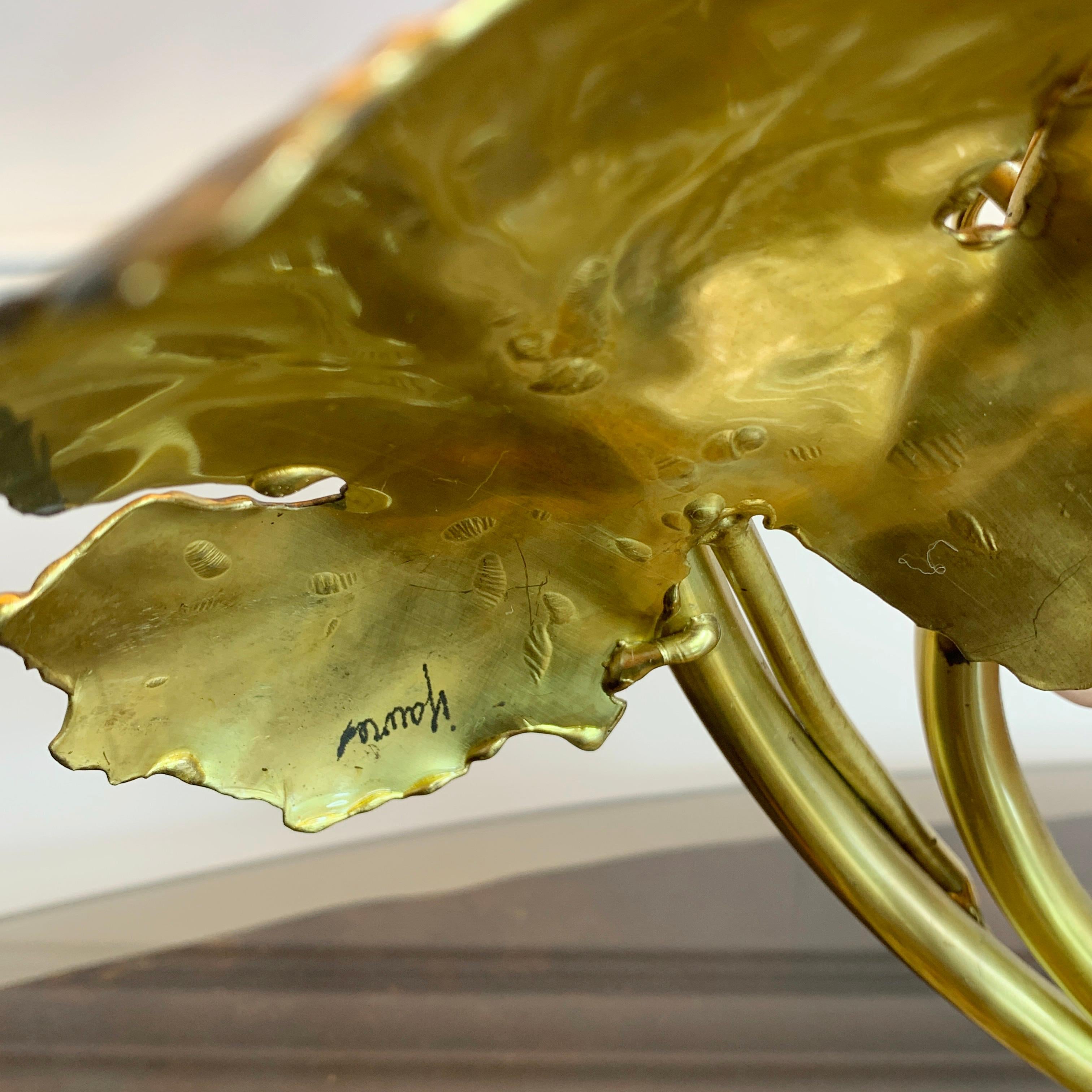 An exceptional table lamp by the renowned design partnership Isabelle and Richard Faure, fully signed and dating to the early 1980's. Hand crafted in burnished and solder brass vine leaves, with an assemblage of grapes in rose quartz. The works of