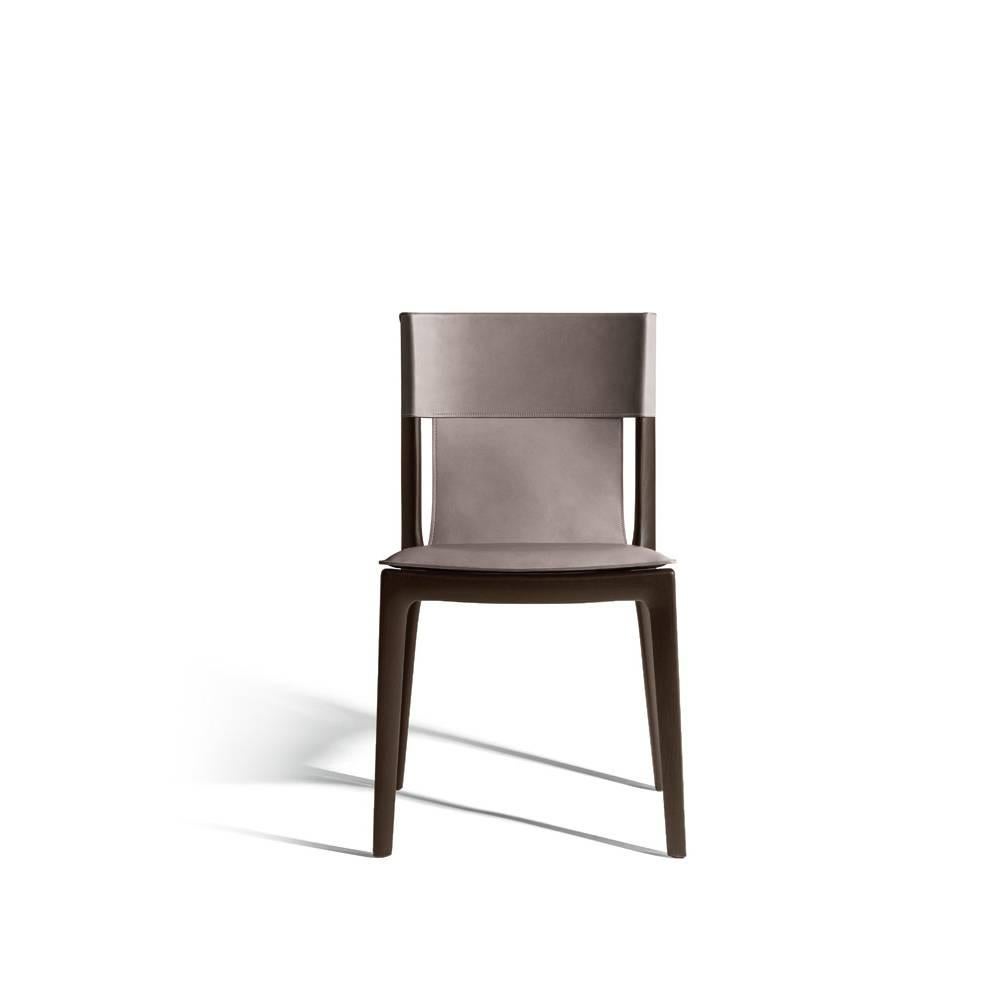 The Isadora chair is inspired by the grace of Isadora Duncan, pioneer of contemporary dance. Created by Roberto Lazzeroni, its original design is shaped by the seamless combination of wood and saddle-leather. The Isadora chair has a solid wood