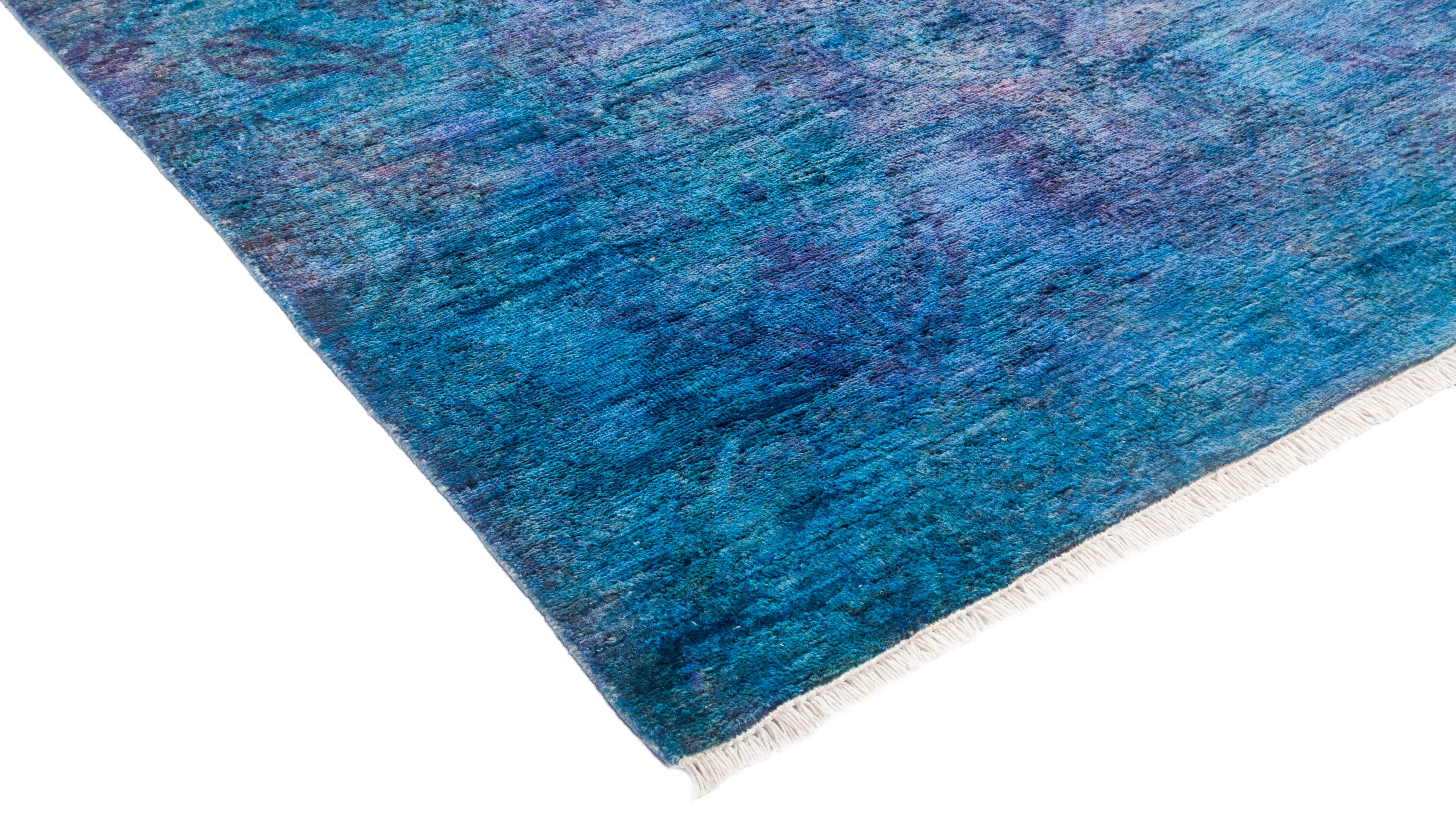 The Vibrance collection features transitional designs in a variety of bold colorways. Hand-knotted using premium, hand-spun wool, these beautiful works of art will last a lifetime. The rugs are overdyed using an environmentally friendly process.