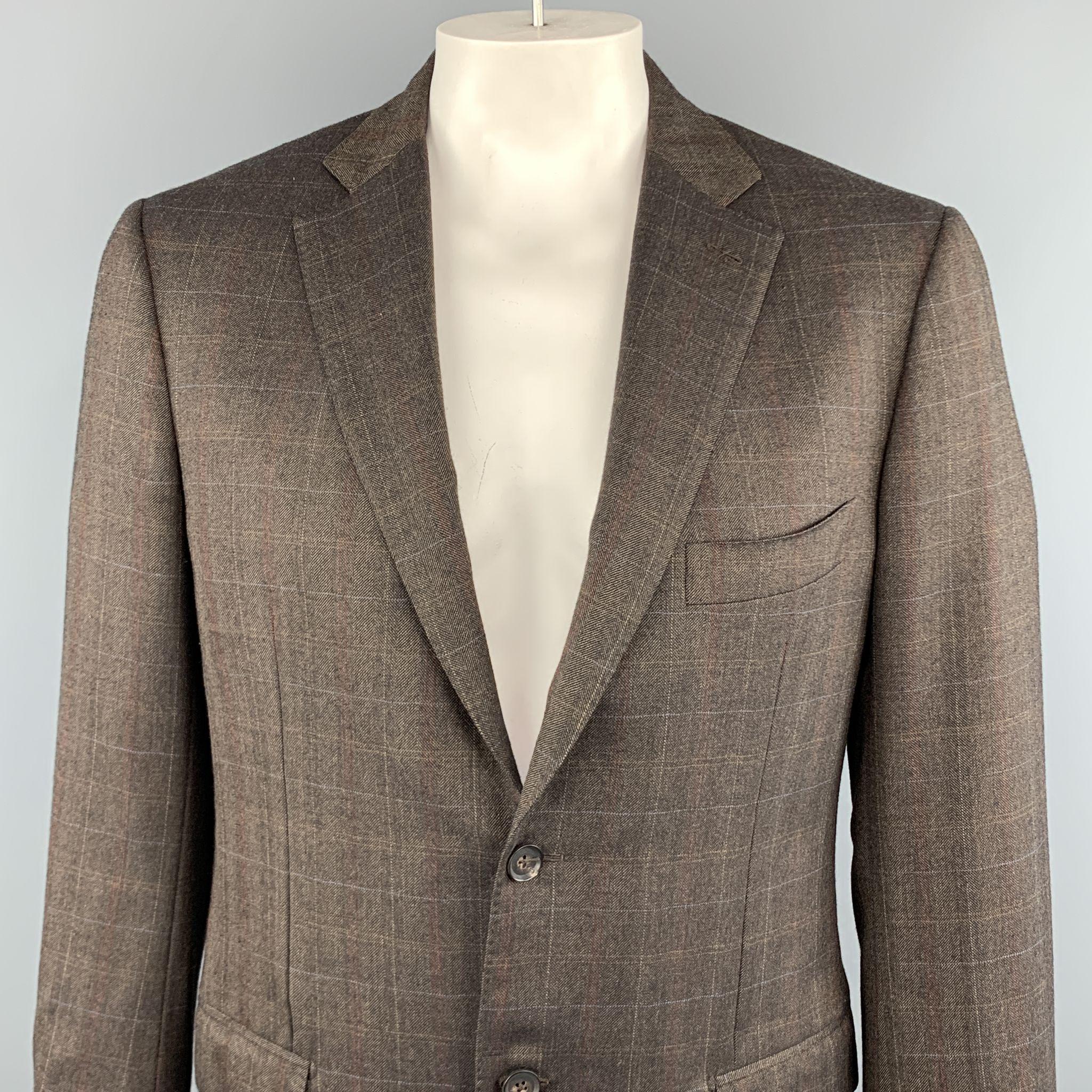 ISAIA sport coat comes in a brown plaid wool featuring a notch lapel style, two button closure, and flap pockets. Made in Italy.
 
Excellent Pre-Owned Condition.
Marked: 52
 
Measurements:
 
Shoulder: 18 in.
Chest: 40 in.
Sleeve: 26.5 in.
Length: 29
