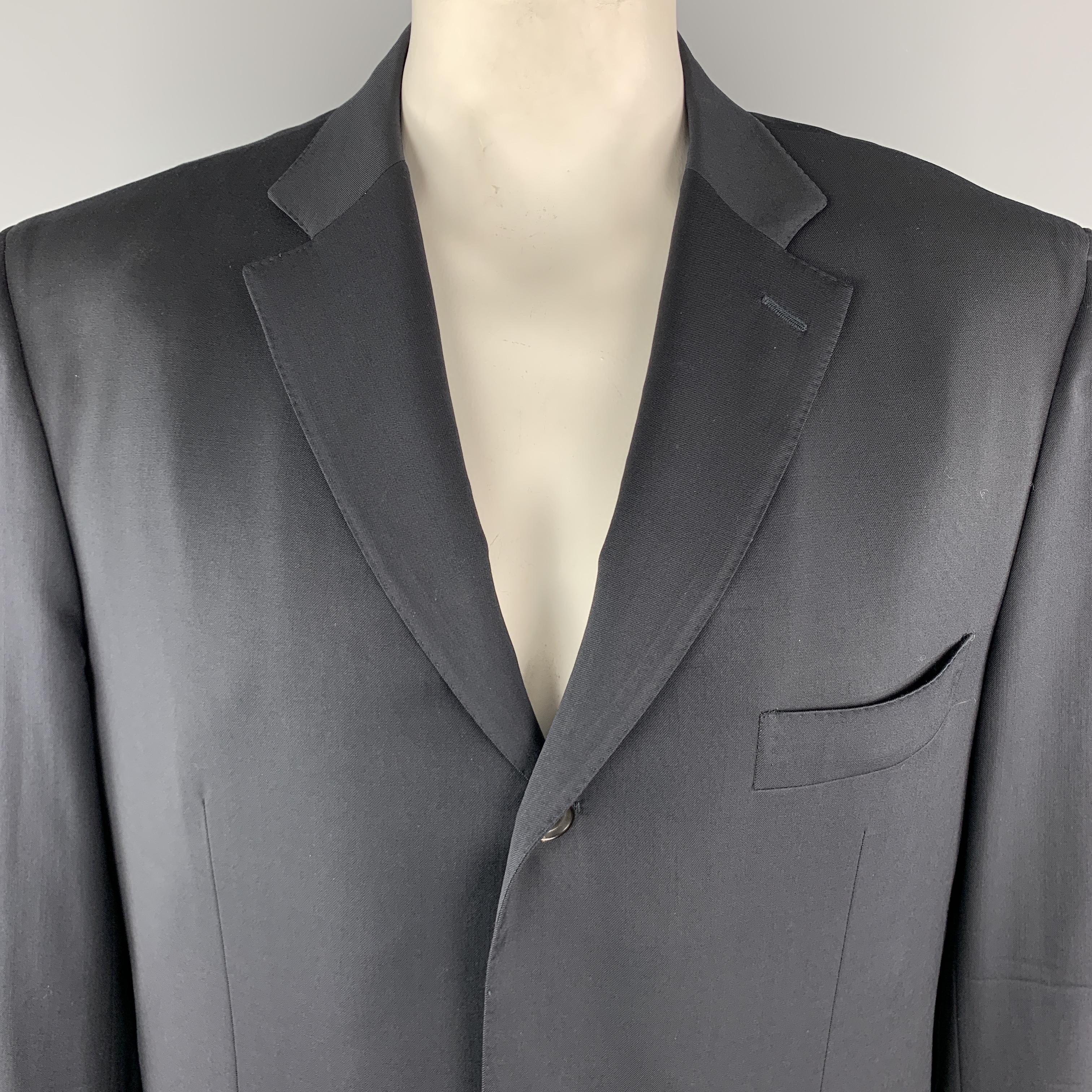 ISAIA Sport Coat comes in a black tone in a solid wool material, with a notch lapel, slit and flap pockets, three buttons at closure, single breasted, functional buttons at cuffs, and a double vent at back. Made in Italy. 

Excellent Pre-Owned