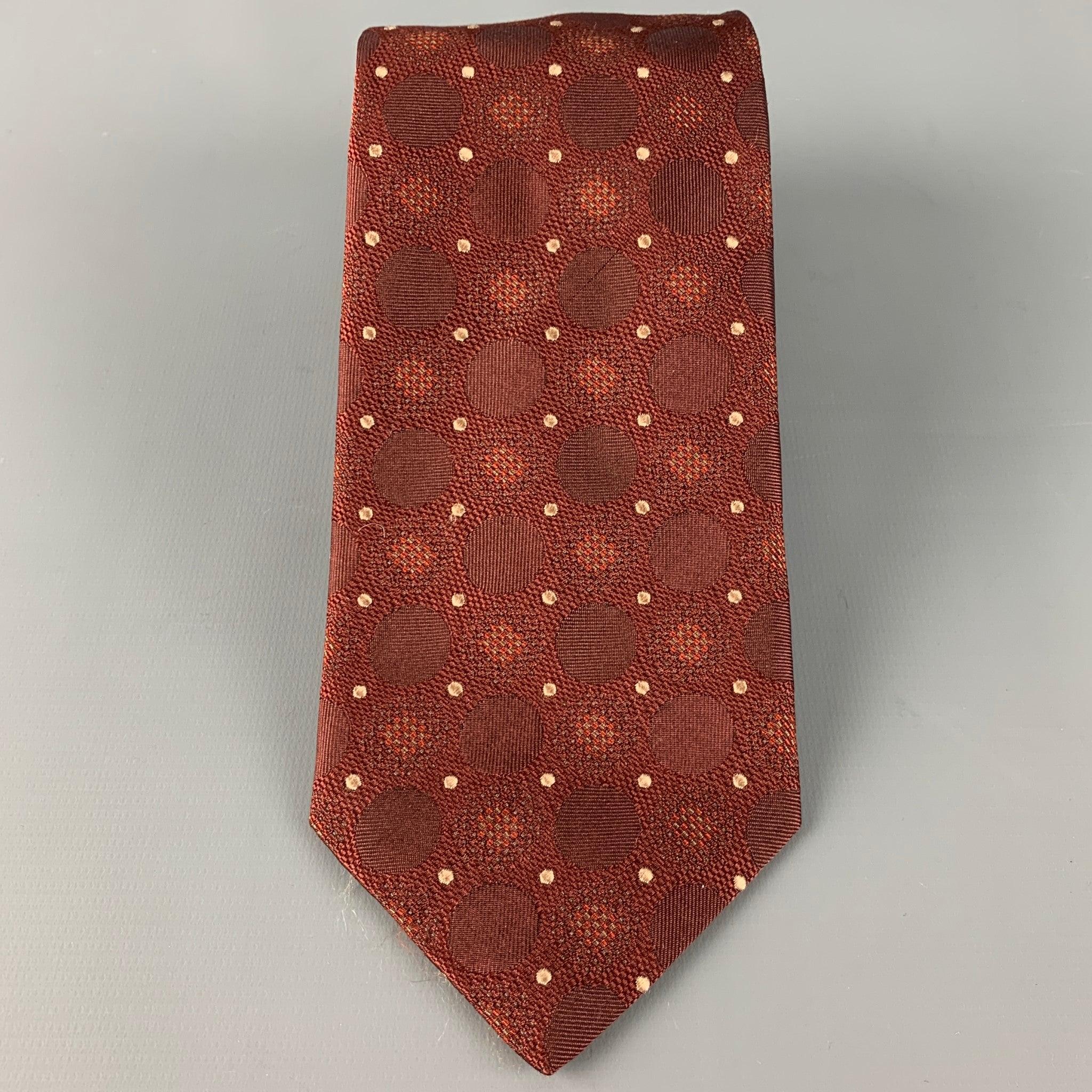 ISAIA
tie in a brown silk featuring a multi color dots pattern. Made in Italy.Very Good Pre-Owned Condition. 

Measurements: 
  Width: 3.5 inches Length: 61 inches 
  
  
 
Reference: 126557
Category: Tie
More Details
    
Brand:  ISAIA
Color: 