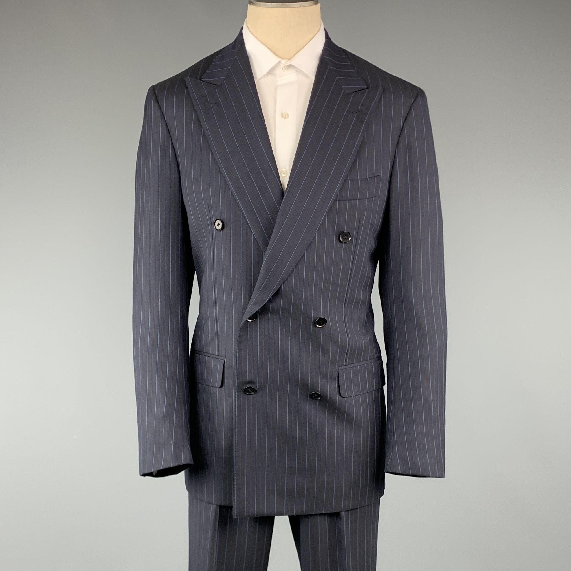 ISAIA suit comes in a navy stripe wool and includes a double breasted, sport coat with peak lapel and matching front trousers.

Excellent Pre-Owned Condition.
Marked: 50

Measurements:

Jacket

Shoulder: 19.5 in.
Chest: 40 in.
Sleeve: 27 in.
Length: