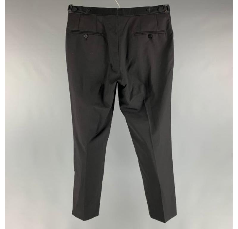 ISAIA dress pants comes in a black wool woven material featuring a flat front, side tabs, welt pockets, and a zip fly closure. Made In Italy.Very Good Pre-Owned Condition. Fabric Tags Removed. 

Marked:  no sign marked 

Measurements: 
 Waist: 32