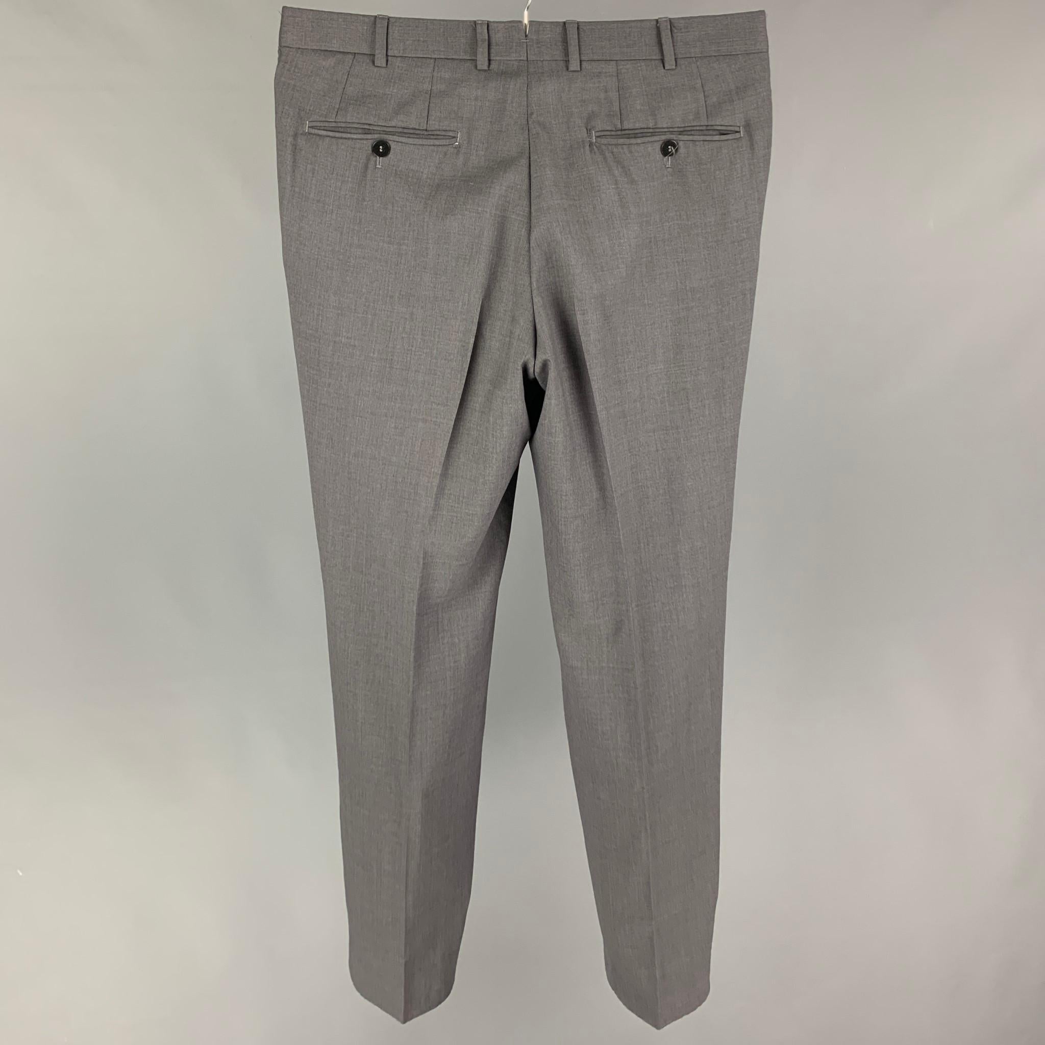 ISAIA dress pants comes in a gray lana wool featuring a flat front and a zip fly closure. Made in Italy. 

Very Good Pre-Owned Condition.
Marked: 48

Measurements:

Waist: 32 in.
Rise: 10 in.
Inseam: 31 in. 