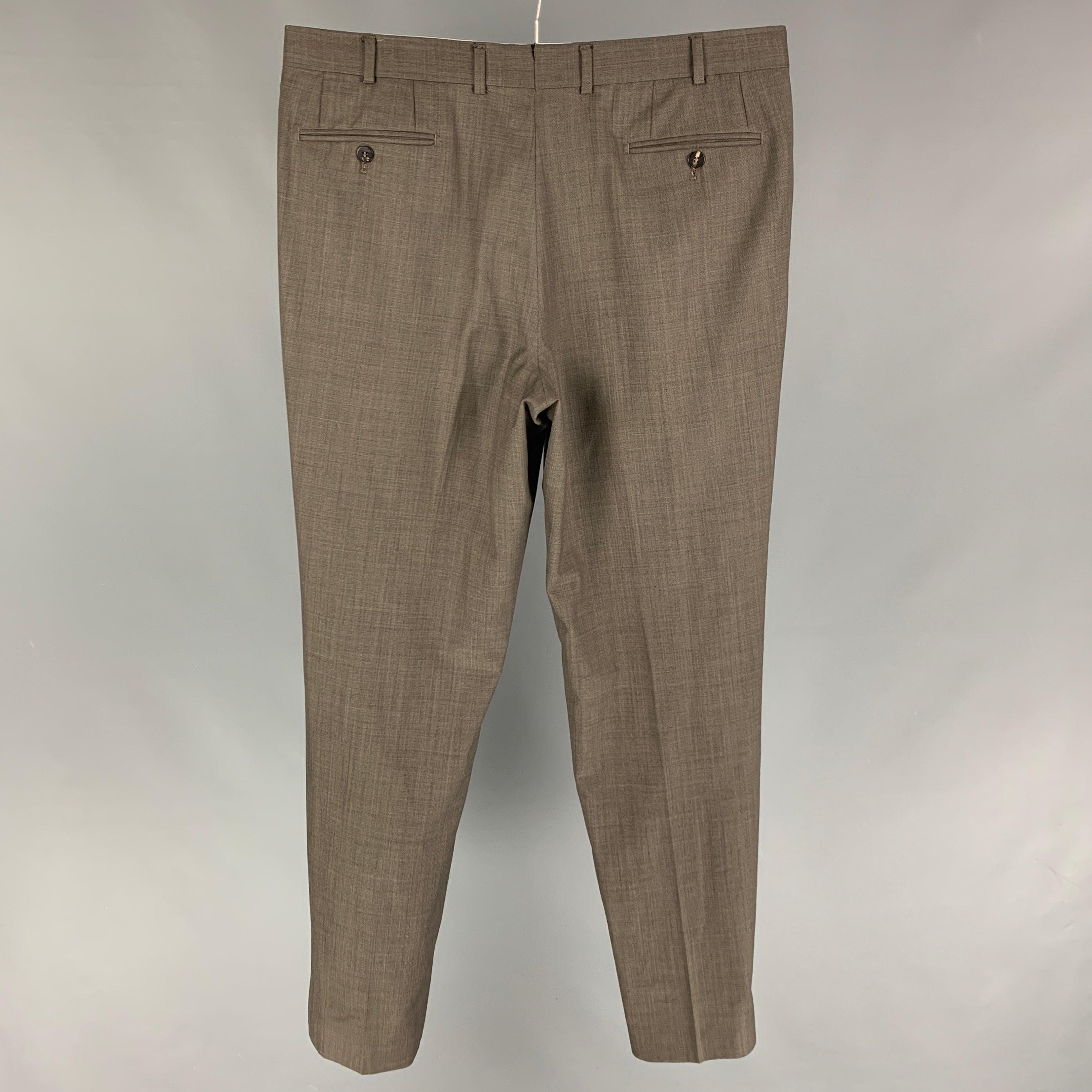 ISAIA dress pants comes in a taupe wool featuring a flat front and a zip fly closure. Made in Romania.
 Very Good
 Pre-Owned Condition. 
 

 Marked:  54 
 

 Measurements: 
  Waist: 36 inches Rise: 11 inches Inseam: 33 inches 
  
  
  
 Sui Generis