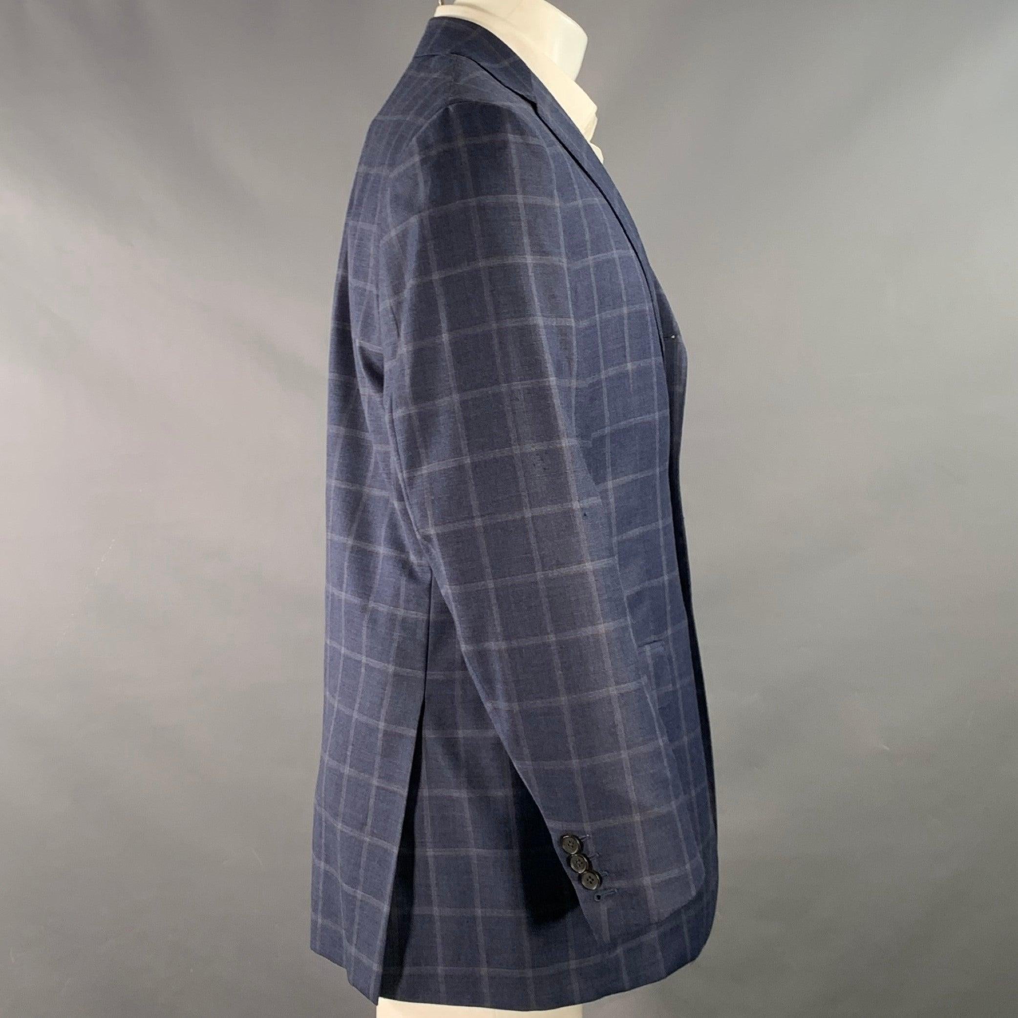 ISAIA sport coat
in a blue and orange wool featuring a plaid pattern, notch lapel, double vented back, and three button closure. Made in Italy.Very Good Pre-Owned Condition. Minor marks and signs of wear. 

Marked:   IT 50 

Measurements: 
