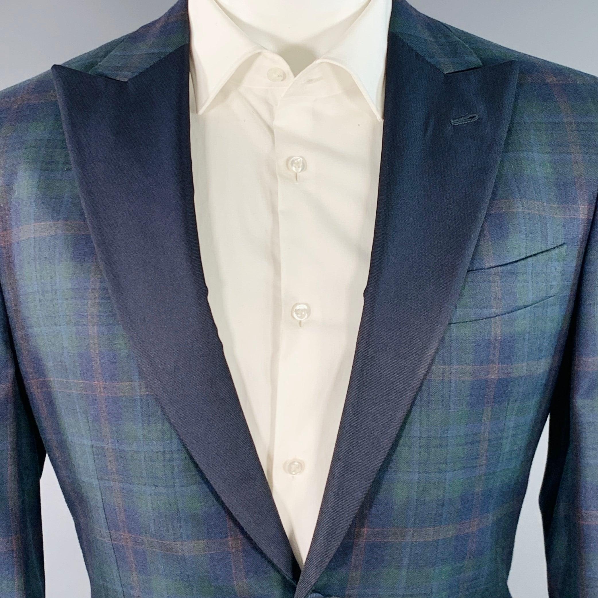 ISAIA sport coat
in a green and navy wool featuring a plaid pattern, contrasting navy grosgrain peak lapel, double vented back, and single button closure. Made in Italy.Excellent Pre-Owned Condition. Fabric and care tags removed. 

Marked:   size