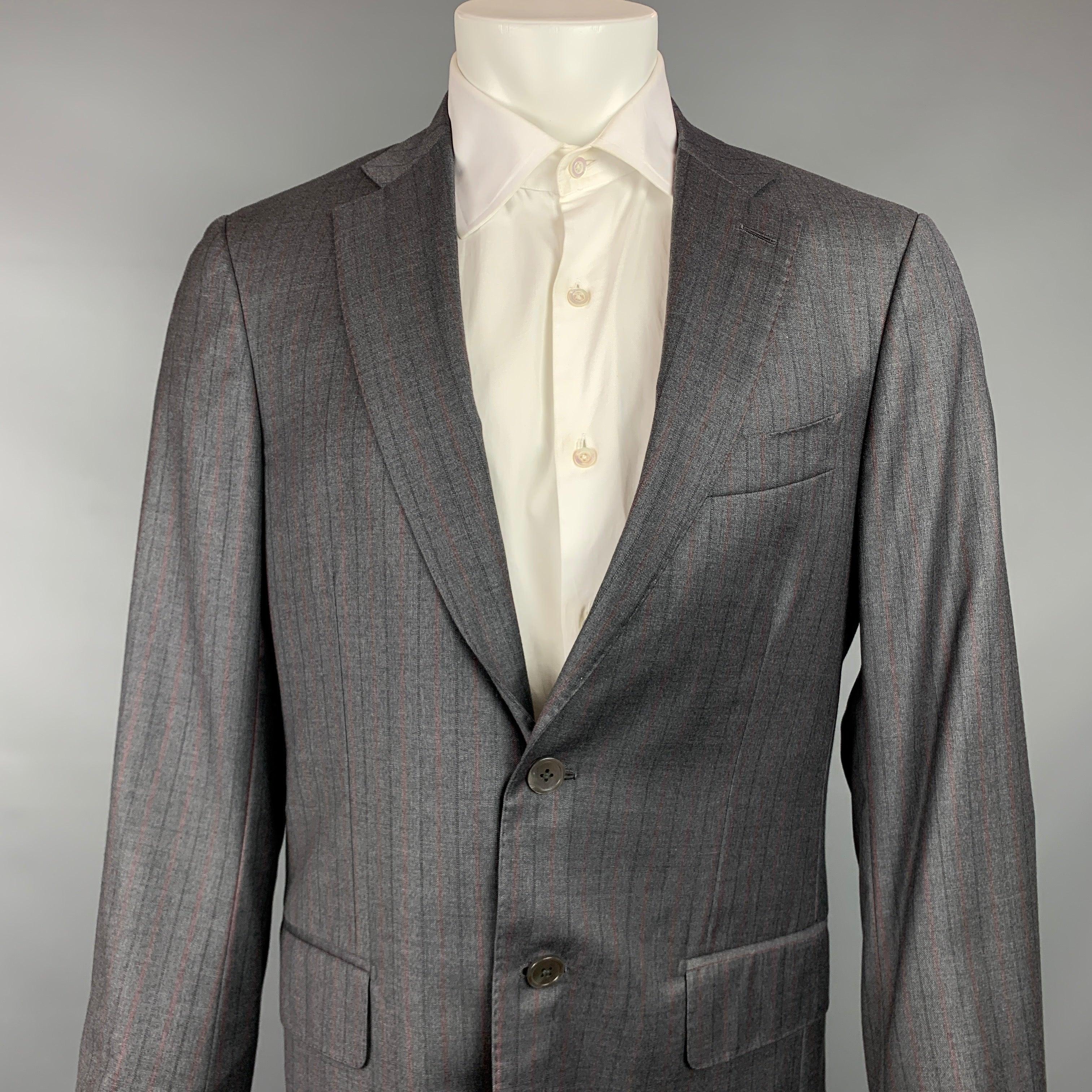 ISAIA
sport coat comes in a gray & charcoal stripe wool with a full liner featuring a notch lapel, flap pockets, and a double button closure. Made in Italy.Very Good Pre-Owned Condition. 

Marked:   50 

Measurements: 
 
Shoulder: 17.5 inches 
