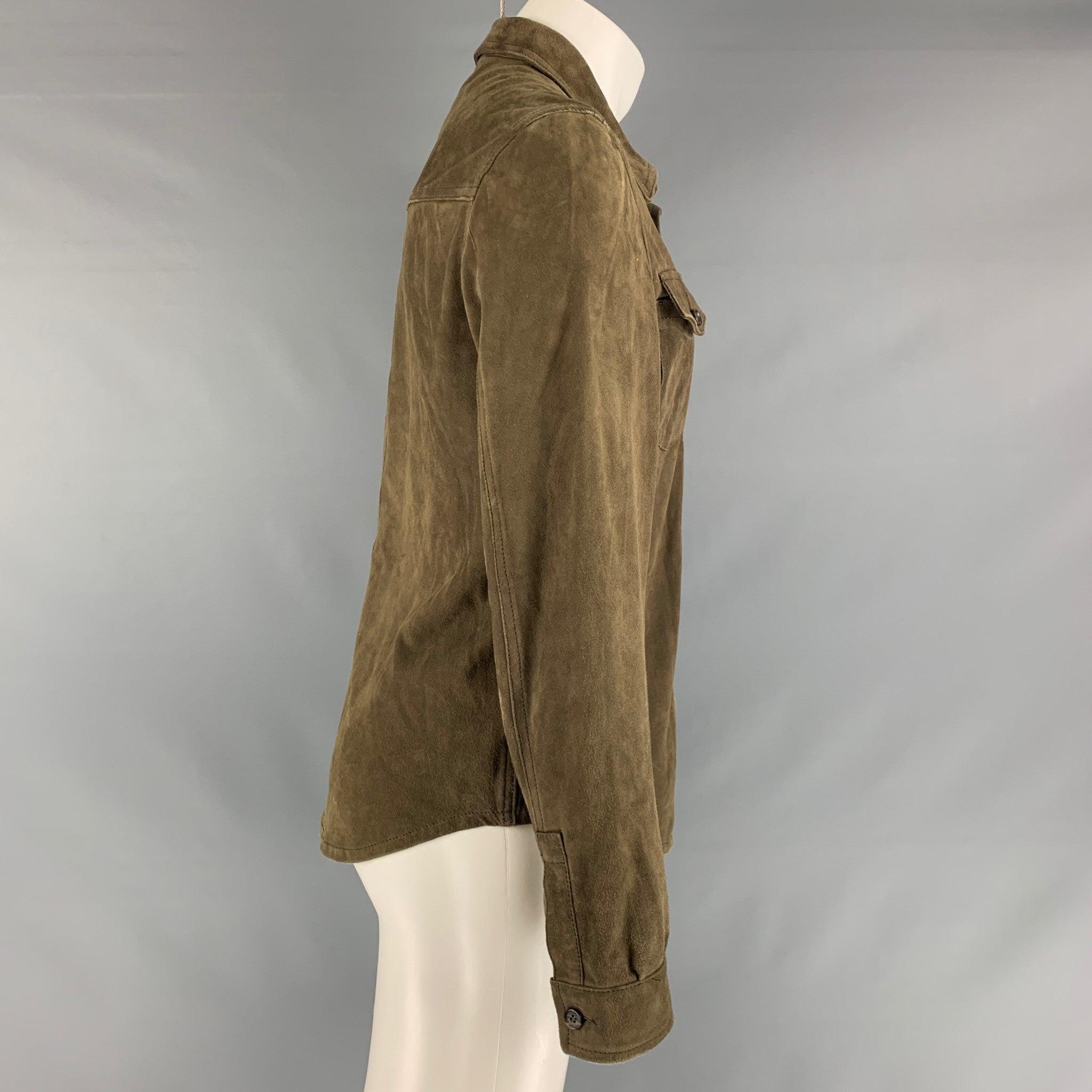 ISAIA jacket come in olive solid leather featuring a straight collar, flap pockets, and button down closure. Made in Italy.Very Good Pre-Owned Condition. Moderate signs of wear. 

Marked:   50 

Measurements: 
 
Shoulder: 19 inches Chest: 42 inches
