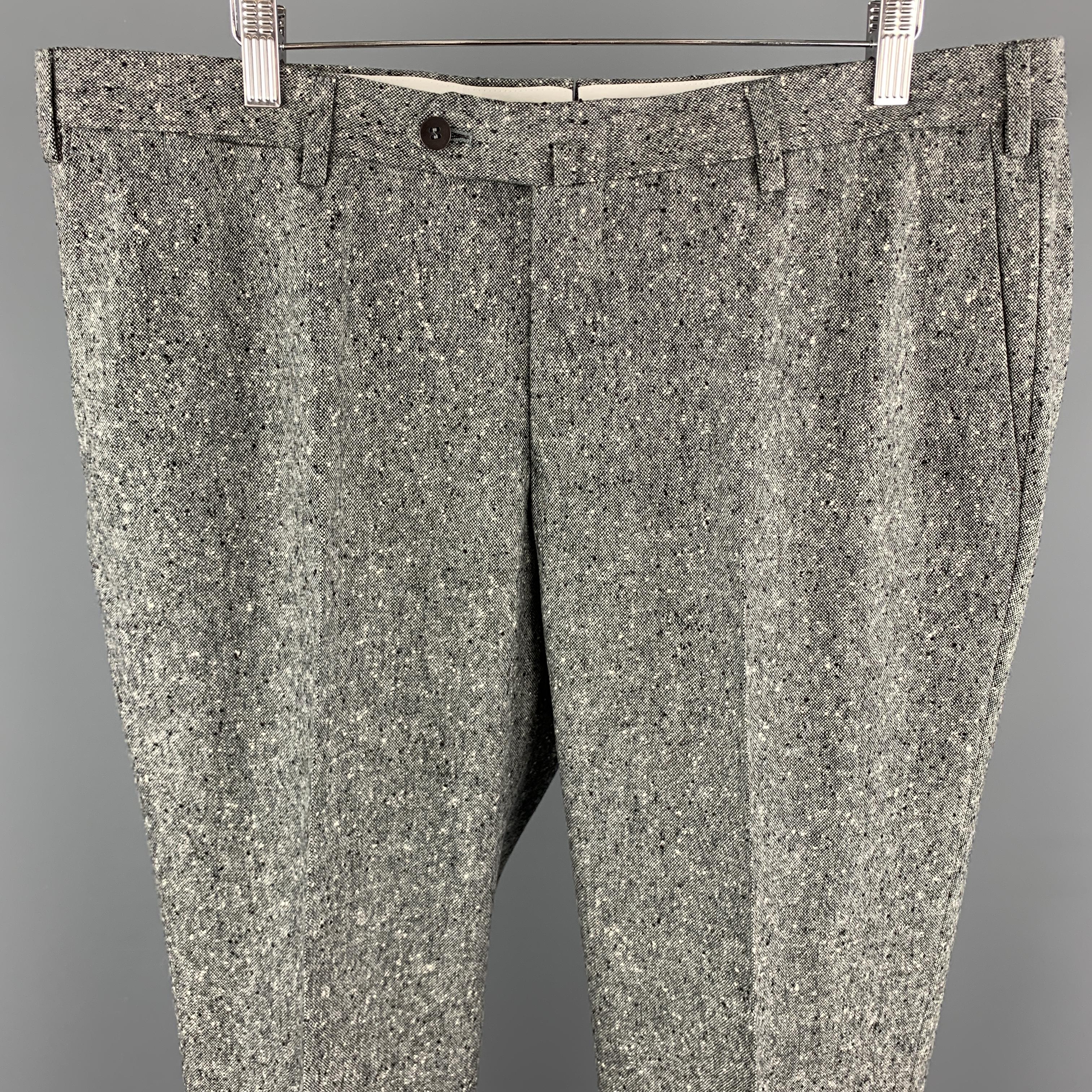 ISAIA dress pants come in gray speckled woven wool with a flat front leg and tab waistband. Made in Italy.

Excellent Pre-Owned Condition.
Marked: IT 54 R

Measurements:

Waist: 39 in.
Rise: 10 in.
Inseam: 33 in.