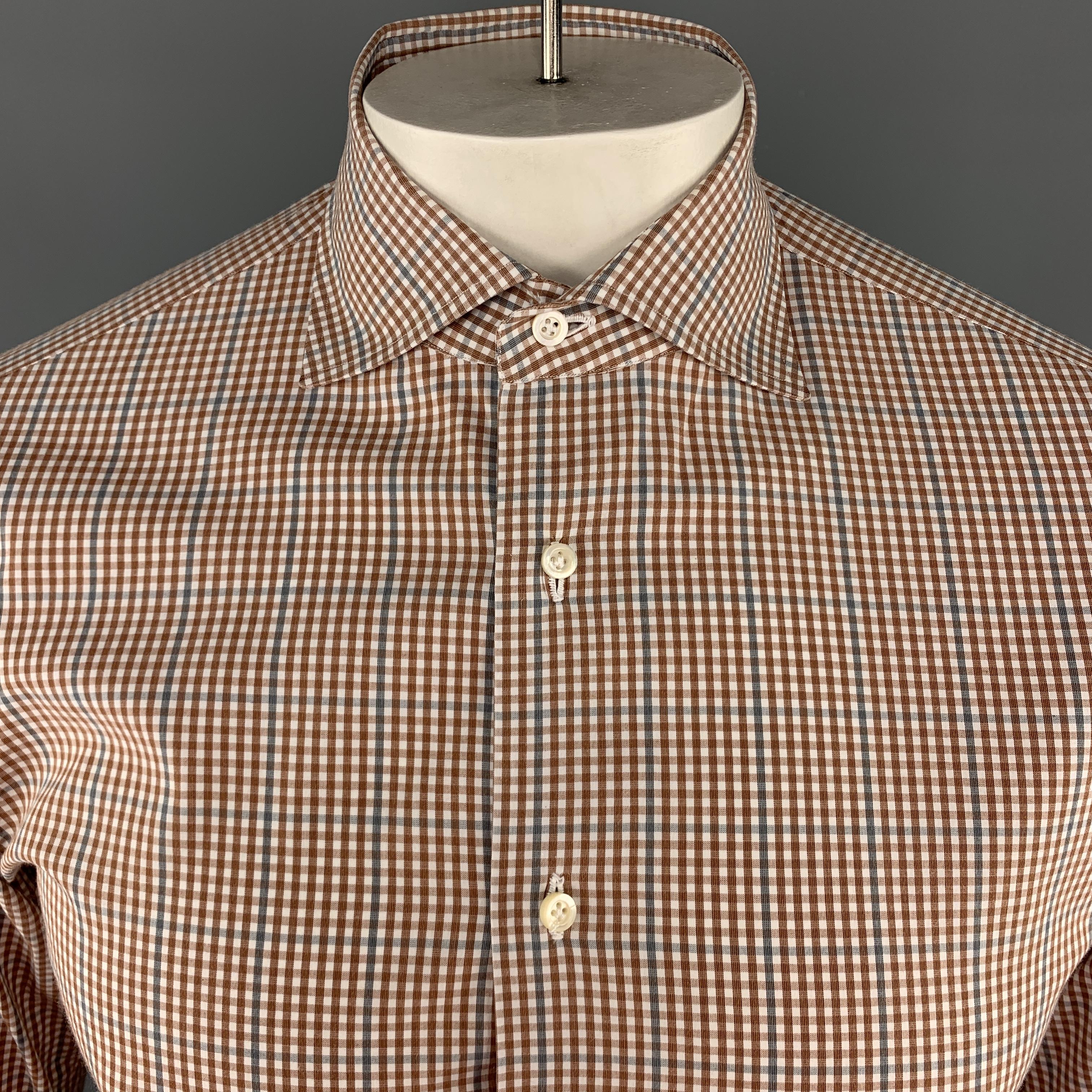 ISAIA Long Sleeve Shirt comes in brick and white tones in a plaid cotton material, with a spread collar, buttoned cuffs, button up. Made in Italy.

Excellent Pre-Owned Condition.
Marked: IT 39

Measurements:

Shoulder: 16 in. 
Chest: 42 in. 
Length: